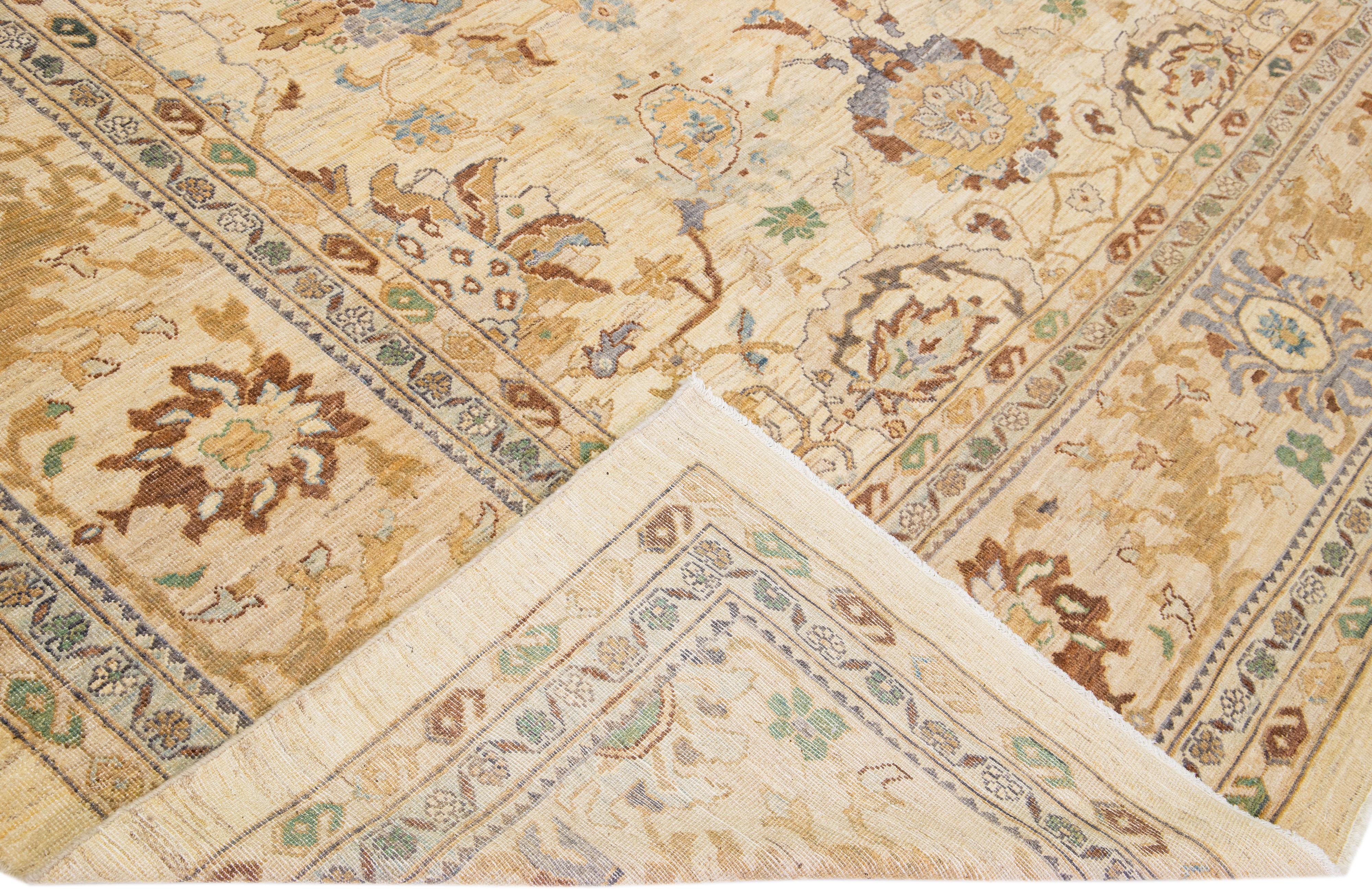 Beautiful modern Sultanabad hand-knotted wool rug with a beige color field. This rug has green, brown, and gray accents in a gorgeous all-over floral design.

This rug measures: 12'3