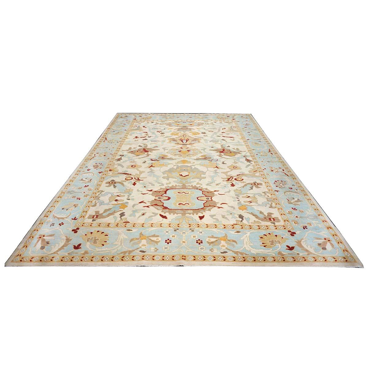 Ashly Fine Rugs presents an antique recreation of an original Persian Sultanabad 10x14 Blue & Ivory Handmade Area Rug. Part of our own previous production, this antique recreation was thought of and created in-house and 100% handmade in Afghanistan