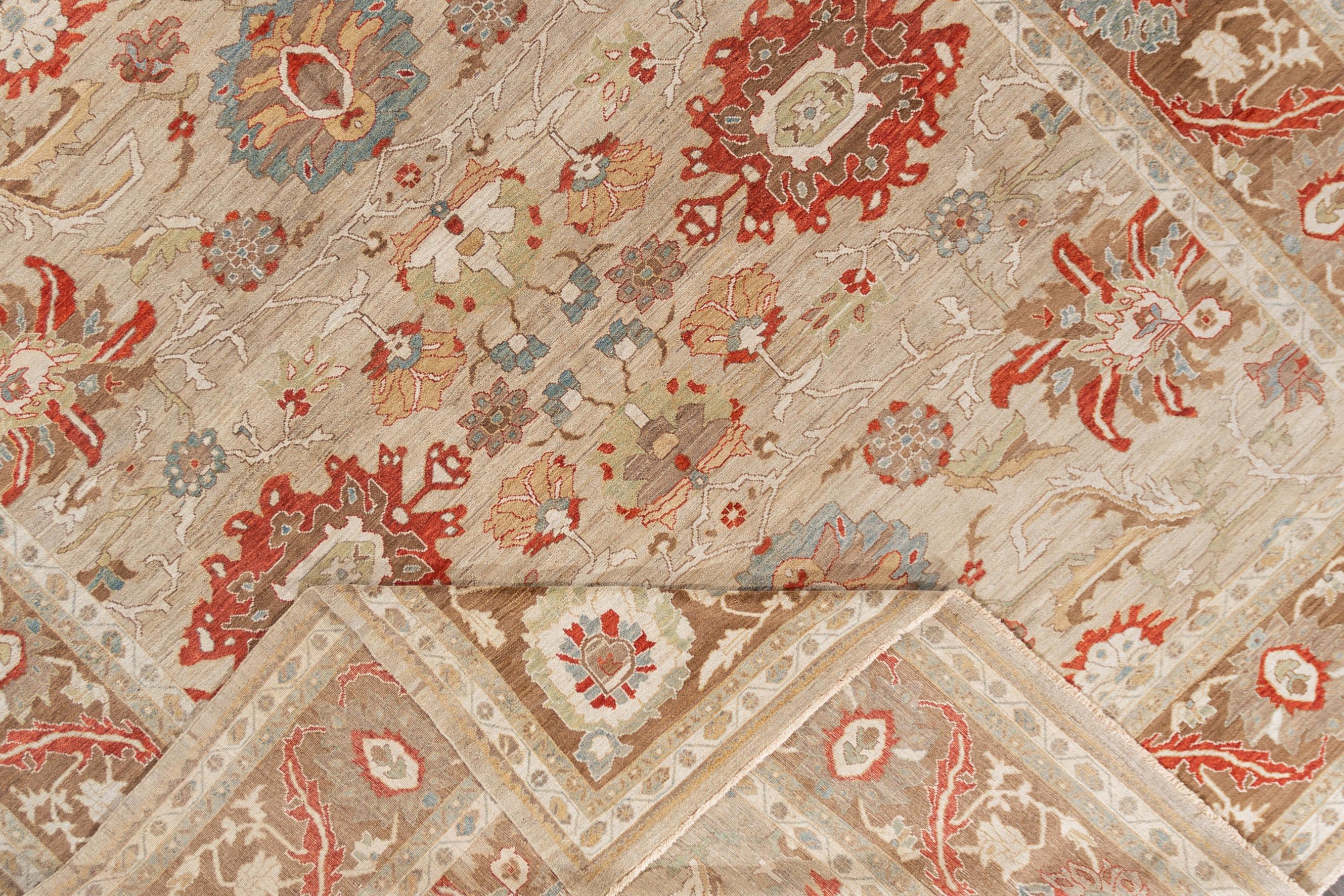 Beautiful contemporary Sultanabad hand knotted wool rug with a light tan field. Multicolored accents in an all-over floral motif design. 

This rug measures at 14'4