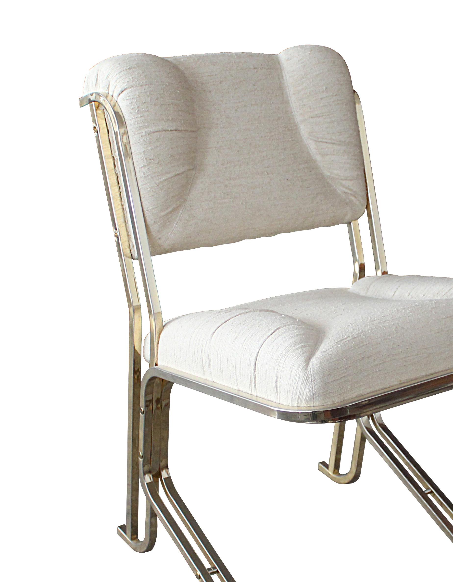 The grace and elegance of swans is celebrated in this exclusive lounge chair that will exude sophisitication into any style interior. The robust frame features parallel, cylindrical elements crafted of satin brass. Generously padded and upholstered