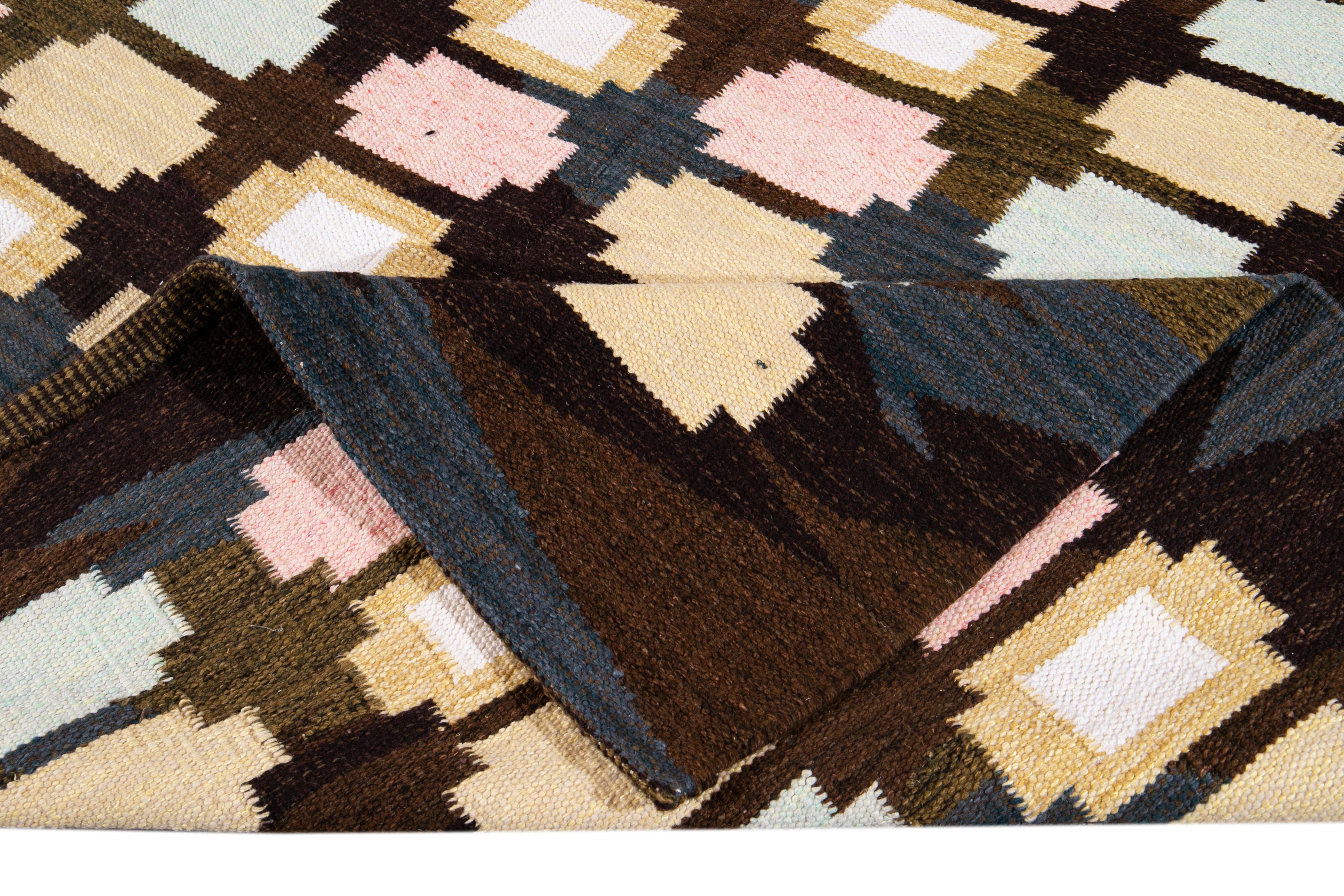 Beautiful Modern Swedish-Style with brownfield and multicolored geometric patterns all over the rug. 

This rug measures 8' 3