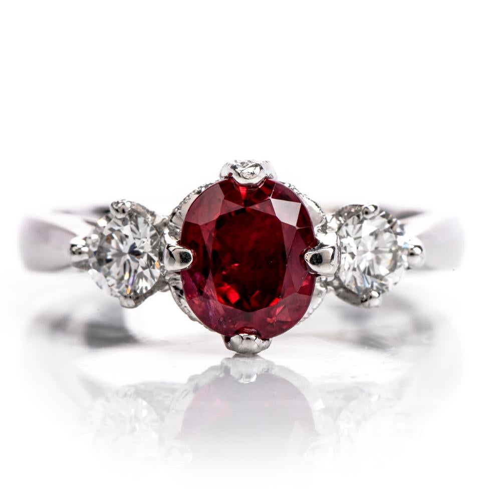 This Diamond Tacori Engagement ring was inspired in a 3 Stone design featuing diamond tulip 

crowns from the profile and crafted in 6.2 grams of Platinum.

This ring features a polished band.

Centerd with a genuine oval shapre ruby weighing