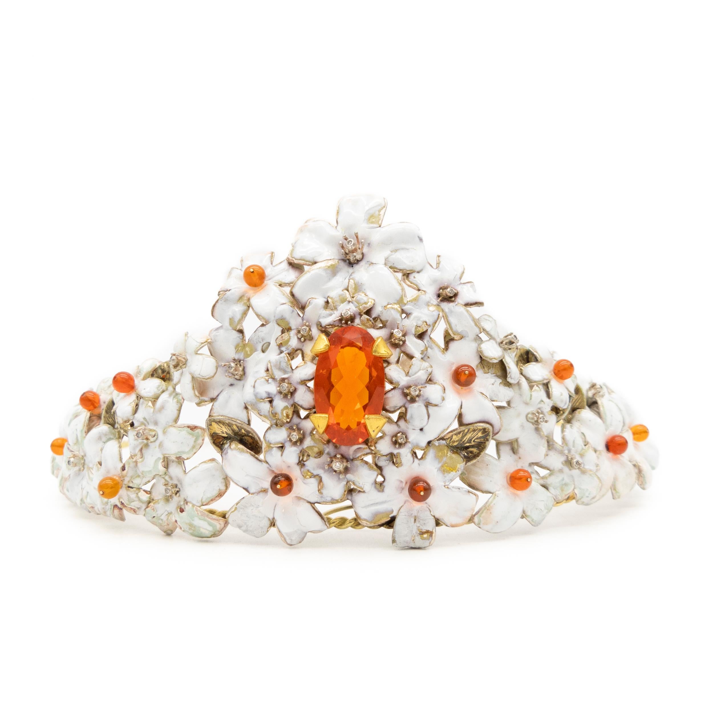 21st Century Tiara Silver White Enameled Oval Central Fire Opal 18 Karat Gold

Tiara made in Silver enameled in white, 18 Karat gold, 12 spheres in fire opals of 4 mm, a central oval fire opal of 9.07 carats and diamonds

Tiara from the Valencia