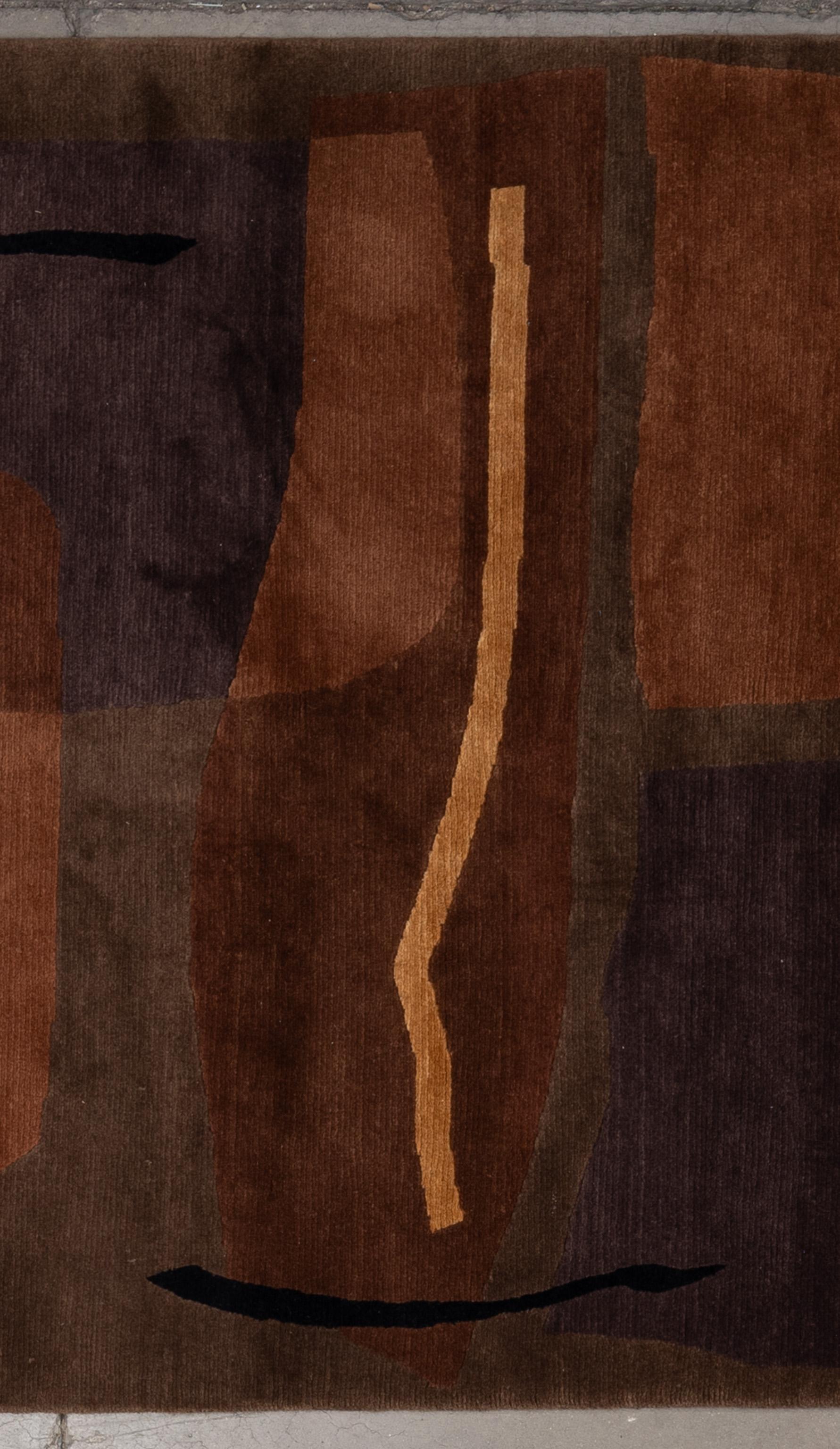 Enhance your home with this luxurious Contemporary wool & silk rug, meticulously handcrafted in Nepal. This exquisite piece features a stunning array of earthy tones, creating a visually captivating centerpiece for any room. Crafted by skilled