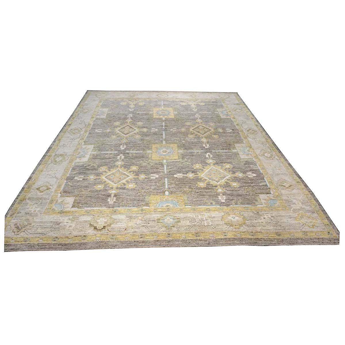   Ashly Fine Rugs presents a 21st century Turkish Oushak 10x13 Handmade Area Rug. Oushak weavings began in a location just south of Istanbul, in a region that was to become the rugs namesake, Oushak. Although nomads first produced the rugs for