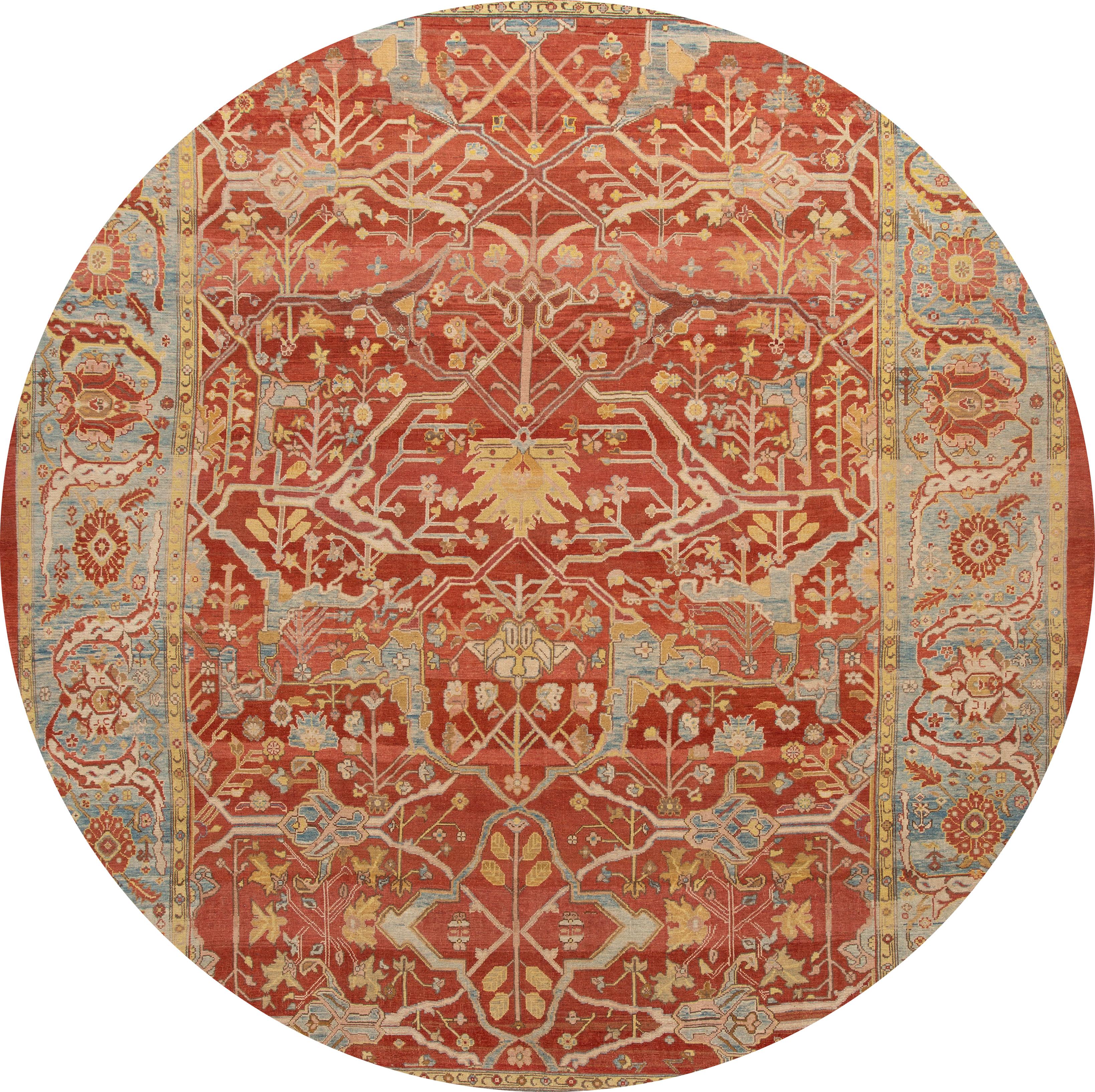 Beautiful Vintage style oversize Bakshaish wool rug with a rust field, and multi-color accents in an all-over geometric design.

This rug measures 13' 7