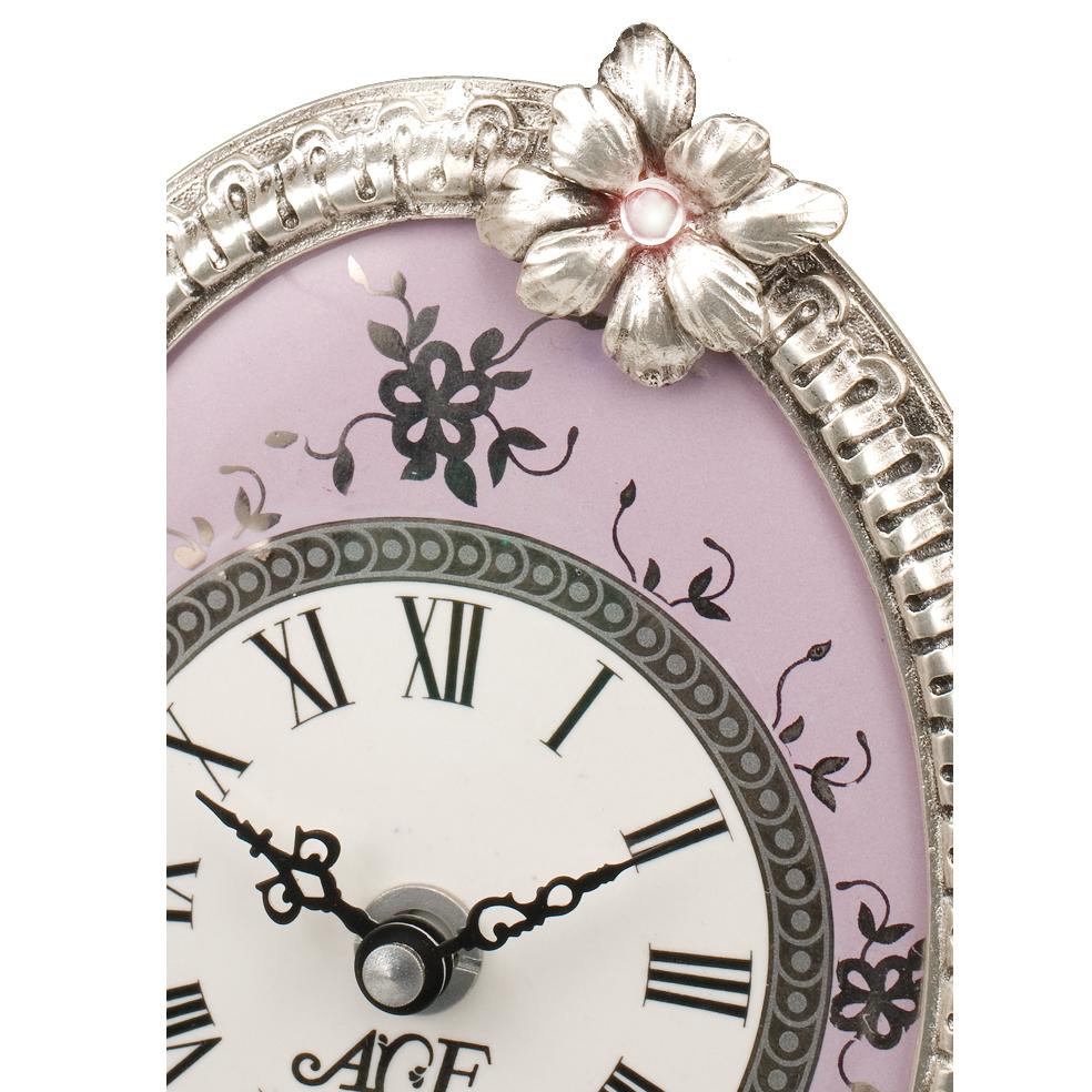 21st Century violet porcelain and silver bronze table clock. This clock is finely chiseled lost wax castings and the porcelain is decorated in platinum. This clock has a quartz movements. On request to customer can modificate the color of crystal: