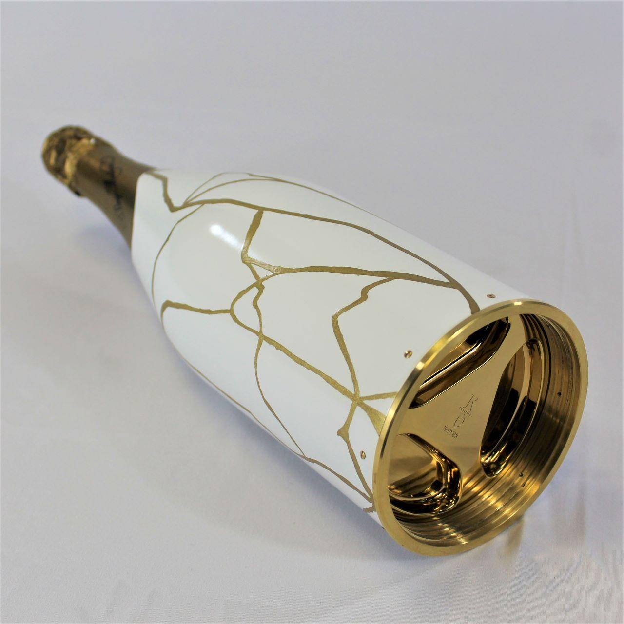 white and gold champagne bottle