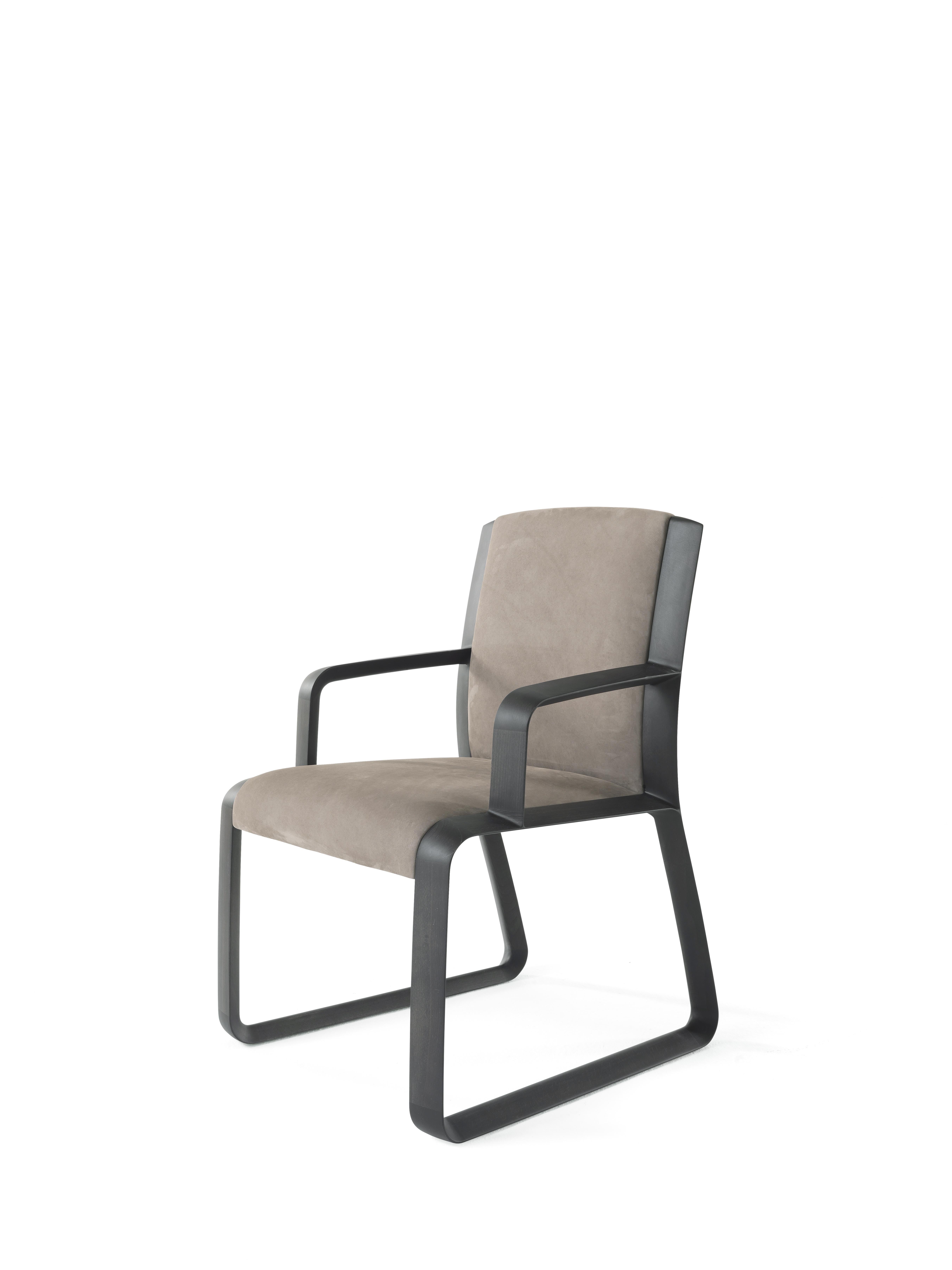 A minimalist aesthetic and a comfortable seat are emphasized by the sensual nubuck upholstery for the Wynwood chair. Height, size and design are studied to complement refined but sober desks or dining tables.
Wynwood Chair with armrests with