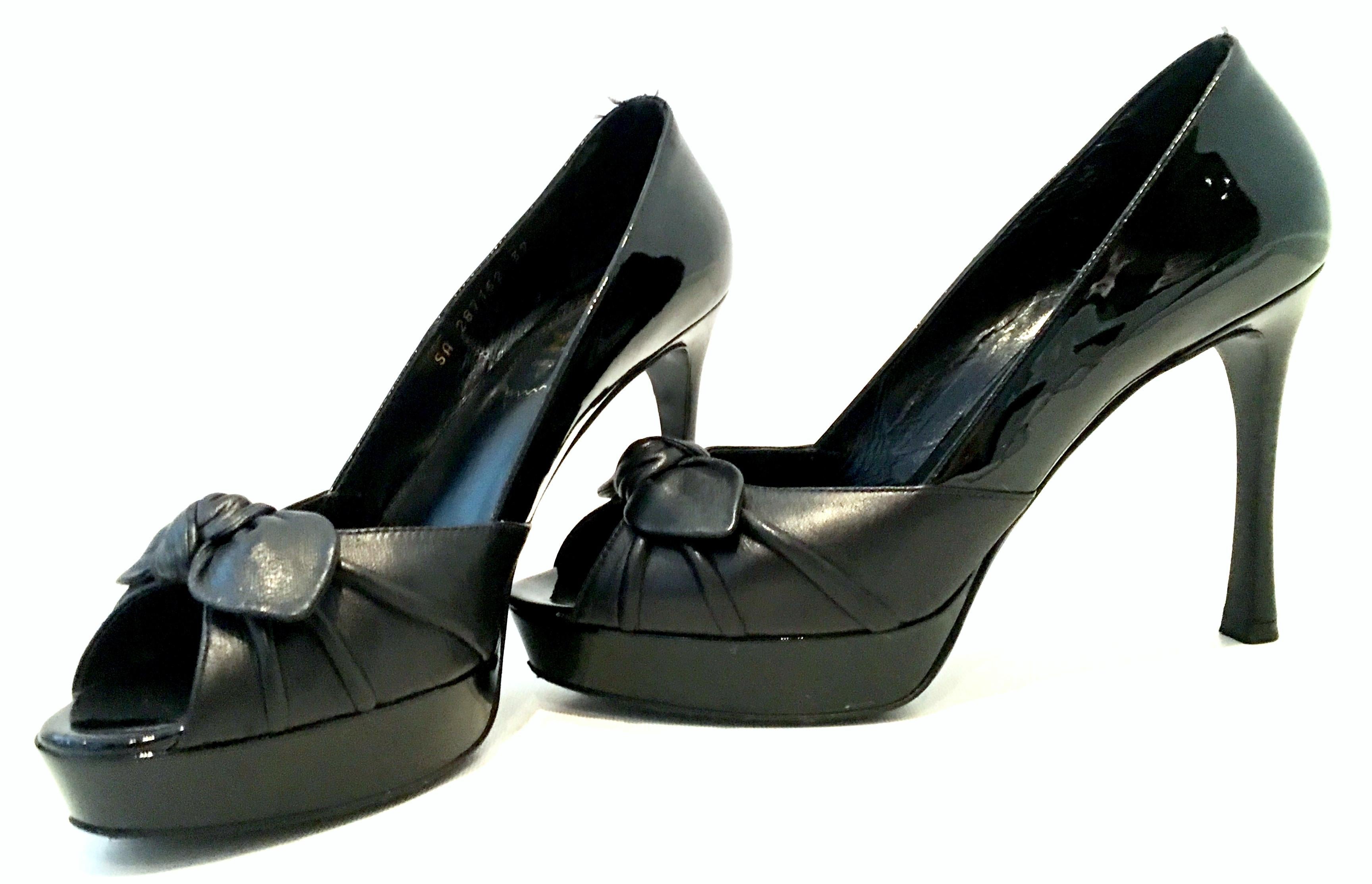 21st Century Yves Saint Laurent-Rive Gauche (YSL) Paris Black Peep Toe Platform Shoes-Size 39. These like new platform stiletto shoes feature a combination of black leather and black patent leather, with a bow detail at the toe. Signed on the