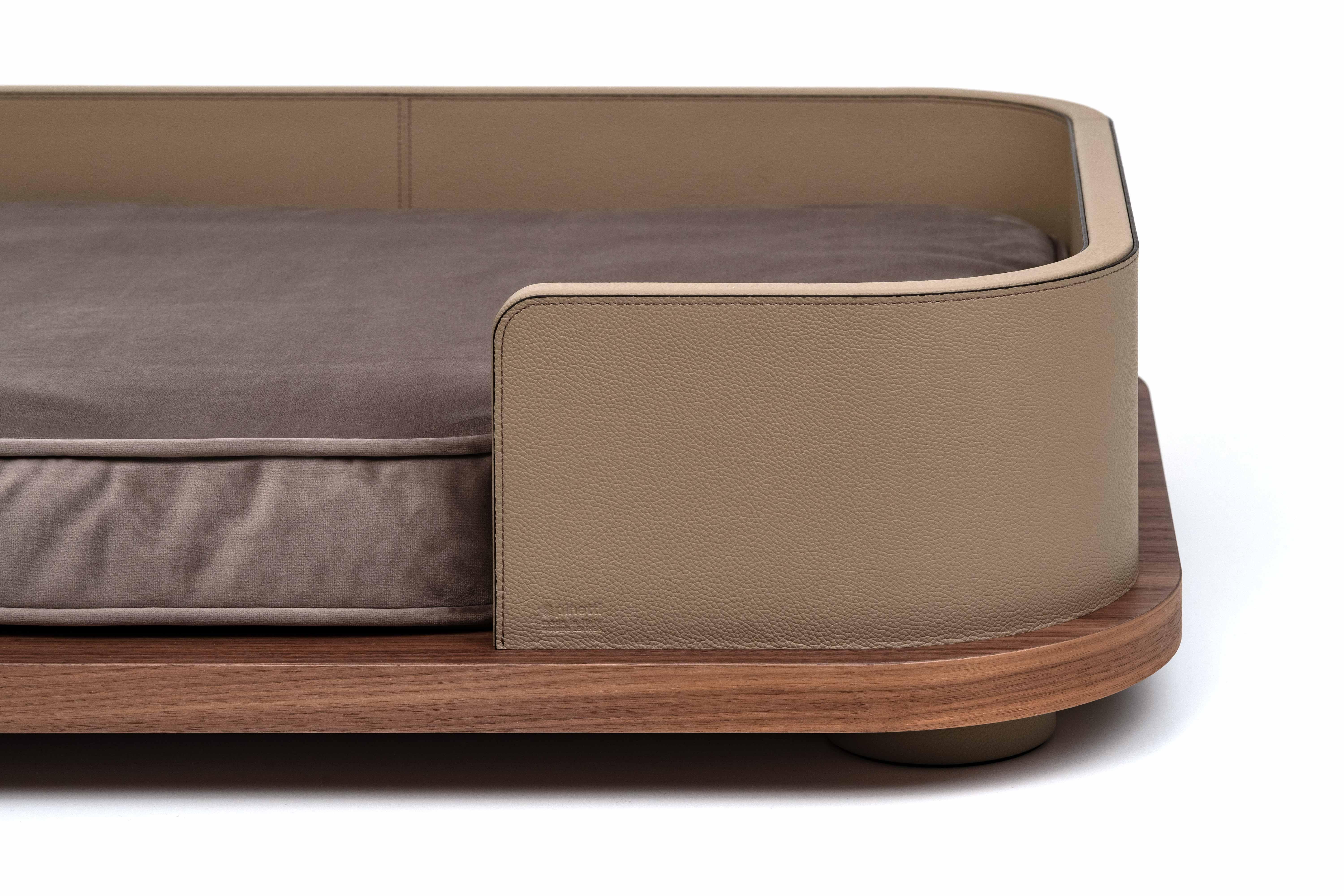 Pamper your furry friends with our new Pet bed.

A wooden structure masterfully handcrafted  covered in leather with precious canaletto walnut wood base and soft memory foam cushion covered in microfiber easily removable and washable. A new line