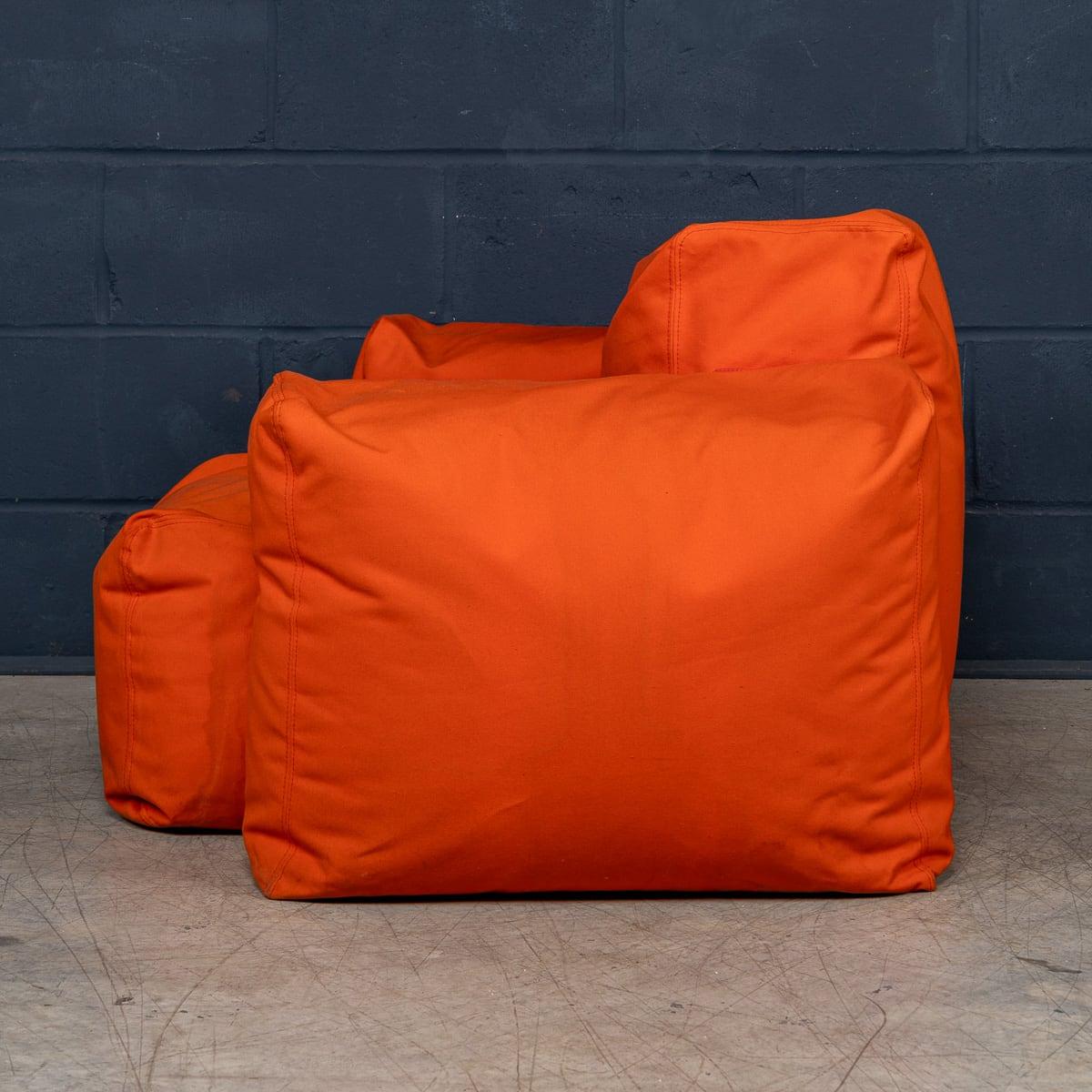 A rare first edition “Superoblong” armchair by Jasper Morrison for Cappellini, Italy, in orange fabric upholstery and contrasting brown stitching.

Jasper Morrison’s design philosophy is rooted in simplicity and functionality, and this iconic