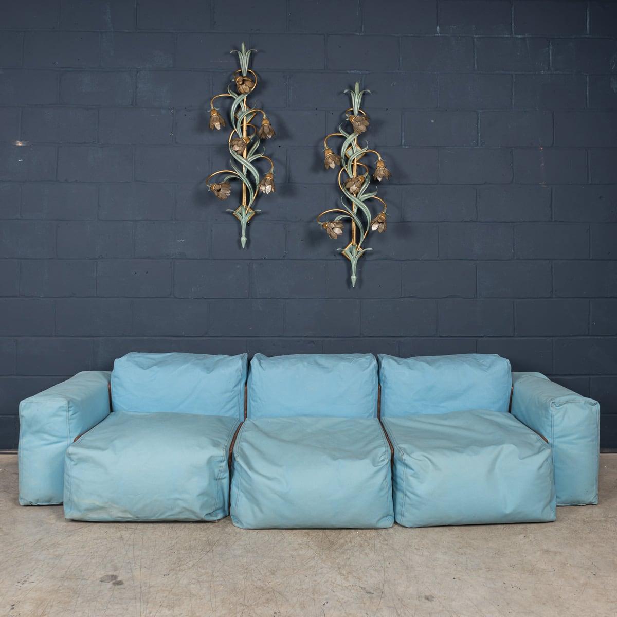 A rare first edition “Superoblong” sofa by Jasper Morrison for Cappellini, Italy, in sky blue fabric upholstery and contrasting brown stitching.

Jasper Morrison’s design philosophy is rooted in simplicity and functionality, and this iconic