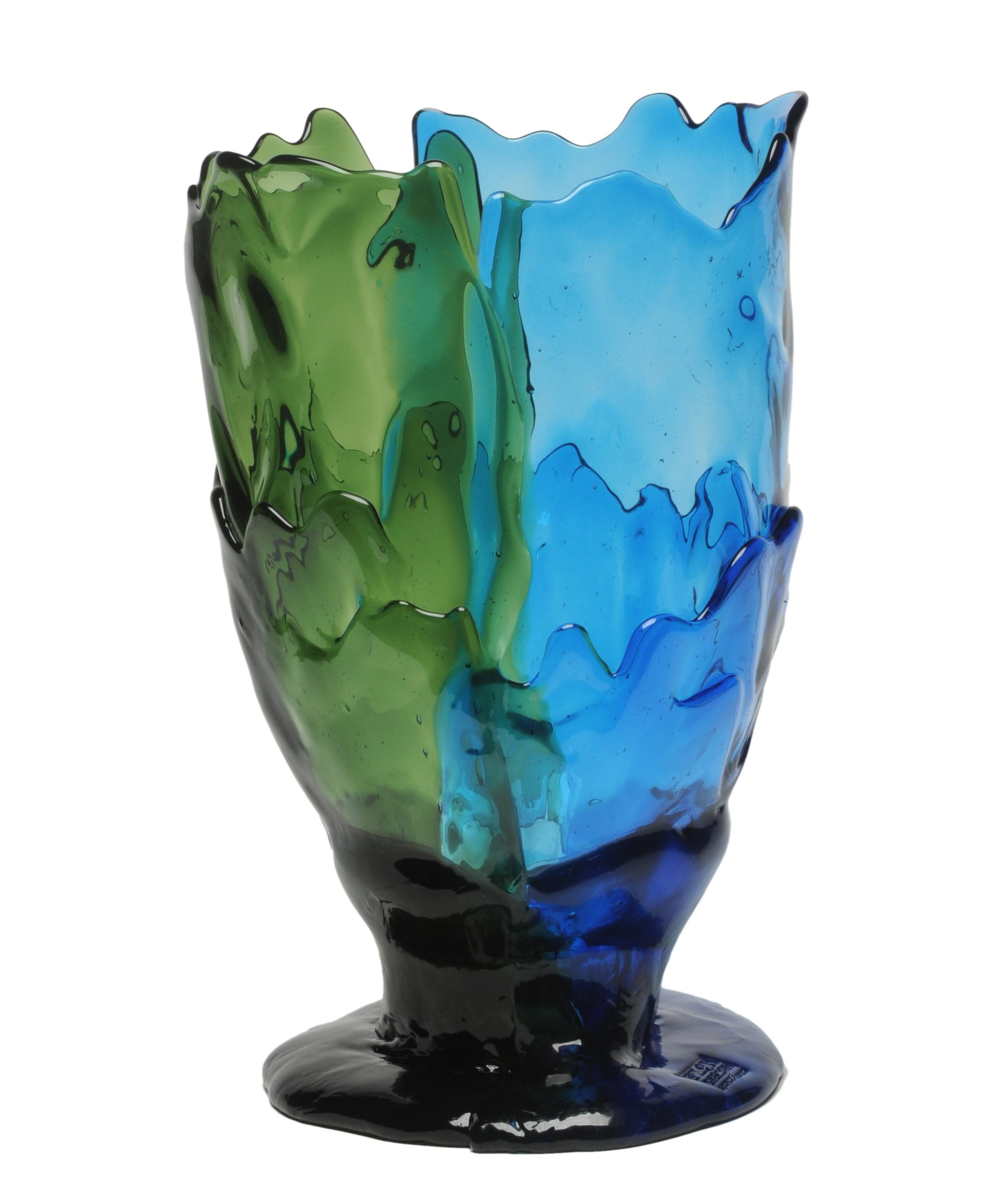 Twin-C vase, clear green and blue.

Vase in soft resin designed by Gaetano Pesce in 1995 for Fish Design collection.

Measures: L - ø 22cm x H 36cm

Other sizes available.

Colours: clear green and blue.

Vase in soft resin designed by Gaetano Pesce