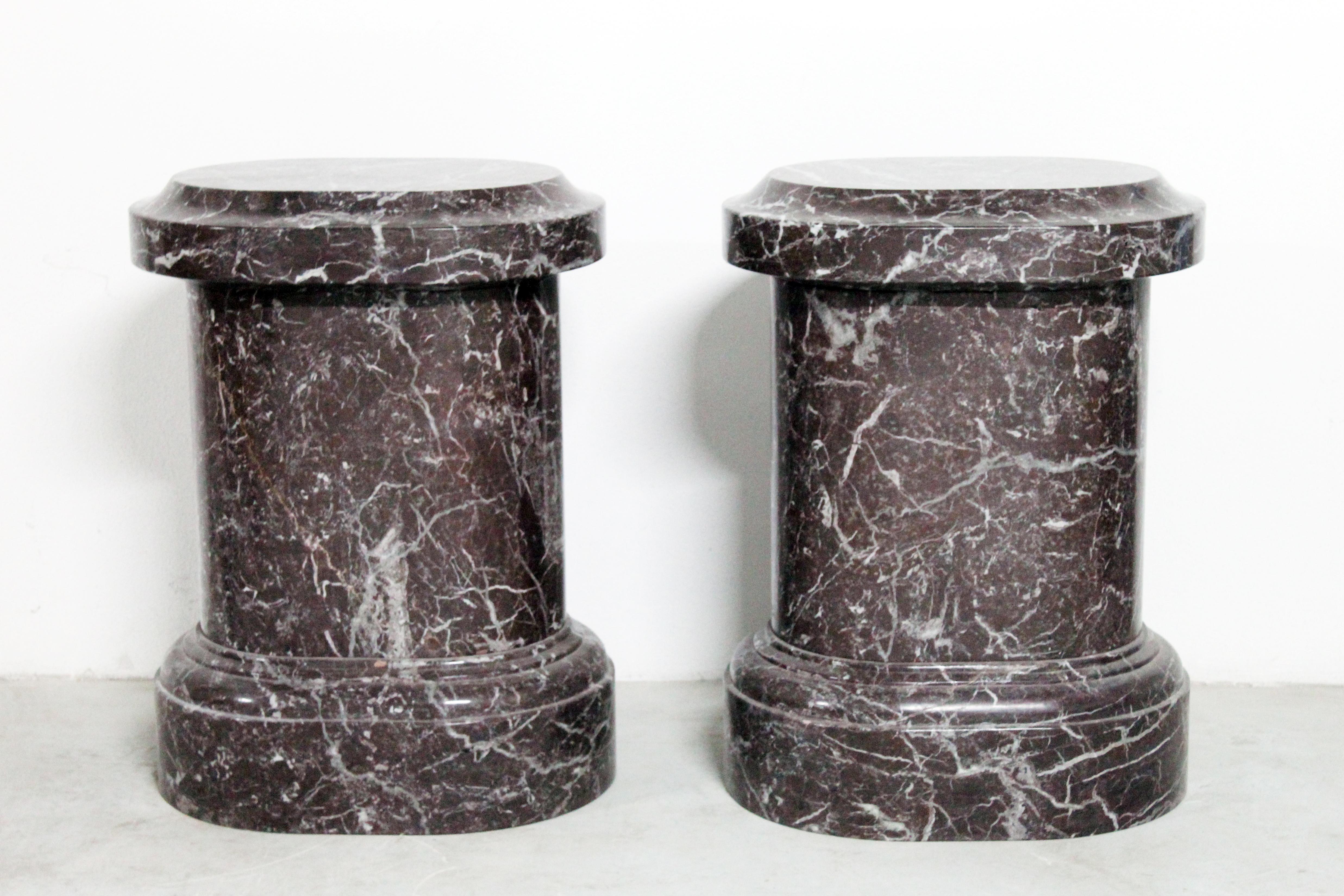 A beautiful pair of pedestals made in red and violet marble called rosso Levanto, quarried in one of the last quarries of this elegant and precious Italian Tuscany marble. Made in solid marble but made empty inside to take out weight but at the same