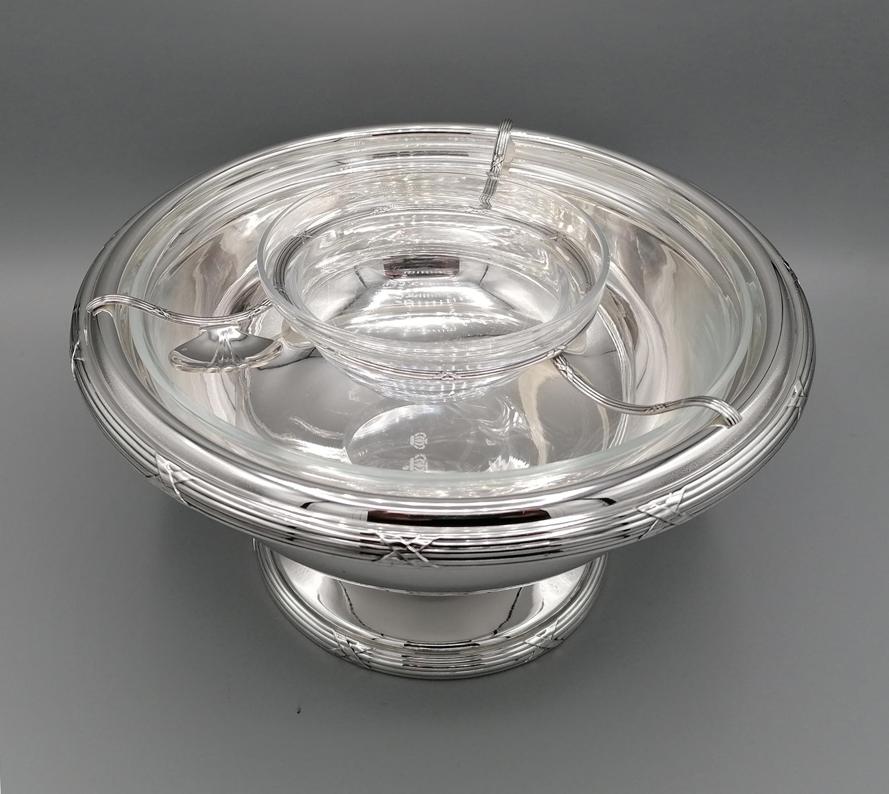 Gorgeous bowl for caviar by Gianmaria Buccellati. 
The body was made in two parts, cup and base. 
The welded edge with cross ribbon characterizes the Classic Luis XVI style. 
A wire circle, also in silver, supports a crystal cup for caviar, while a