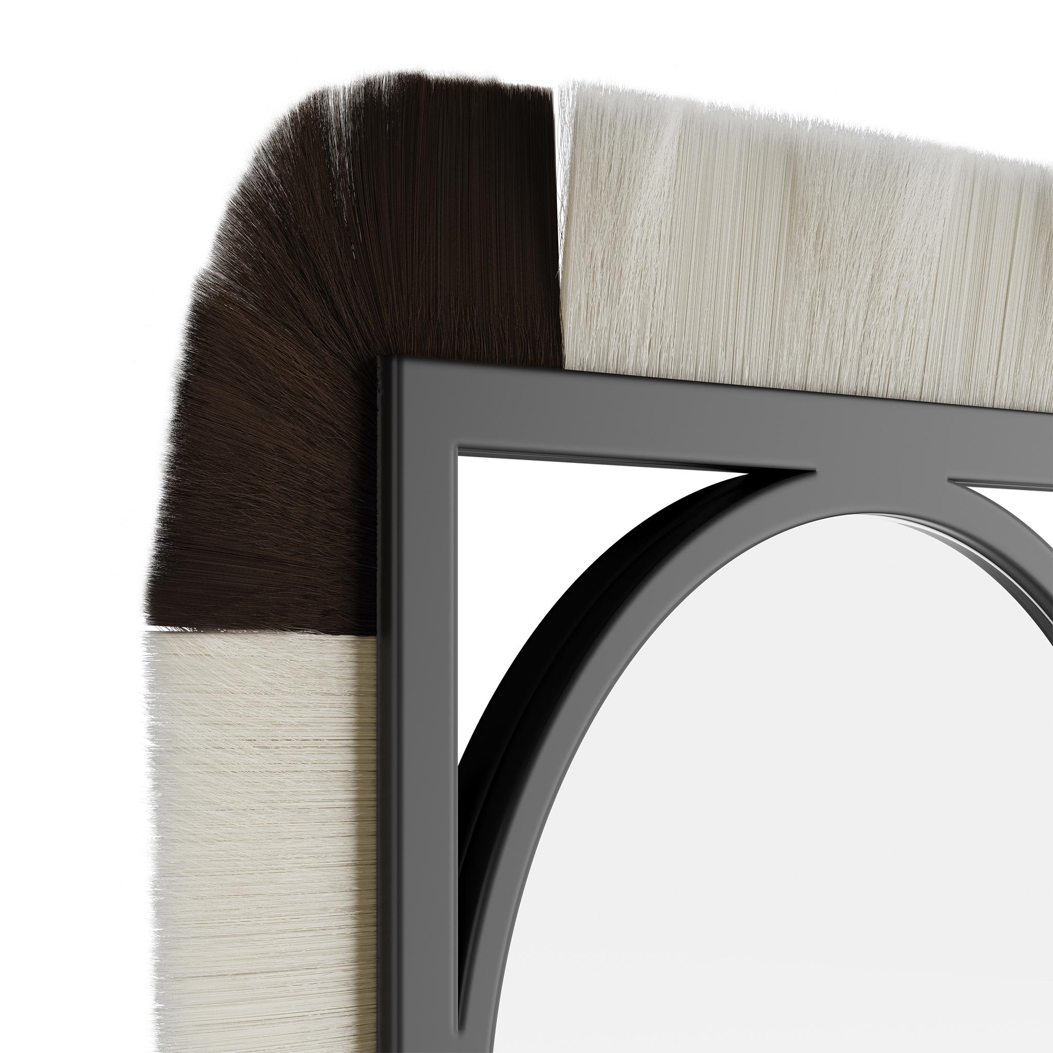 Moritz is a luxury wall mirror inspired by the raw and timeless textures of the tribes' decorations, jewels, and artistic elements. This decorative mirror is made of lacquered wood in the structure and ornamented with vibrant colored fiber. Moritz's