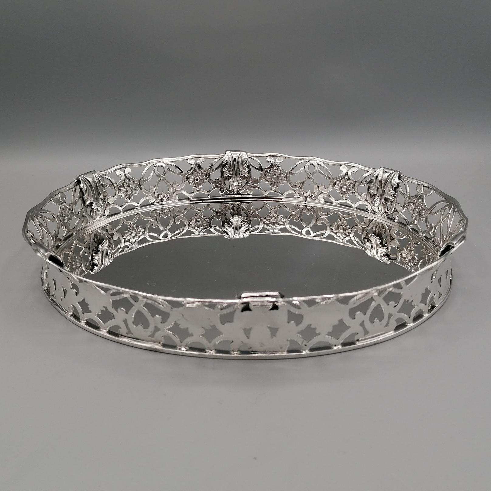 Completely handmade sterling silver oval basket. The basket or tray shape is decorated with a border made with the fusion technique and subsequently chiseled and engraved. The border is decorated with openwork flowers and acanthus leaves.
A wavy