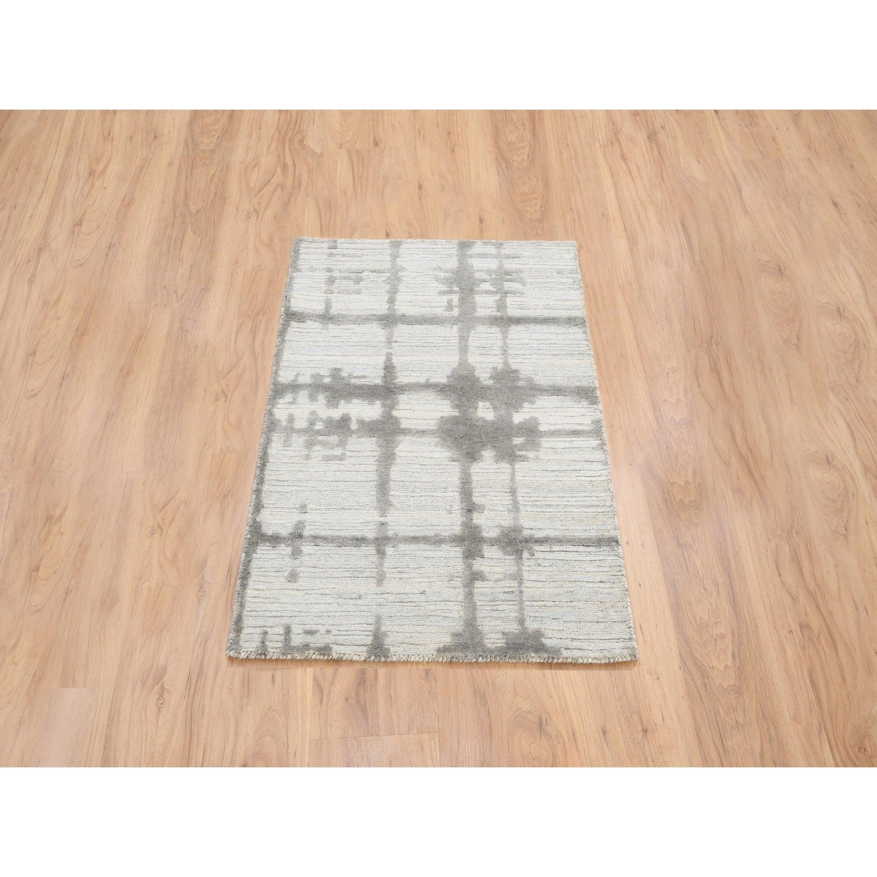 This is a truly genuine one-of-a-kind Ivory Hand Spun Undyed Natural Wool Hand Knotted Modern Design Mat Oriental Rug. It has been Knotted for months and months in the centuries-old weaving craftsmanship techniques by expert artisans.
Primary