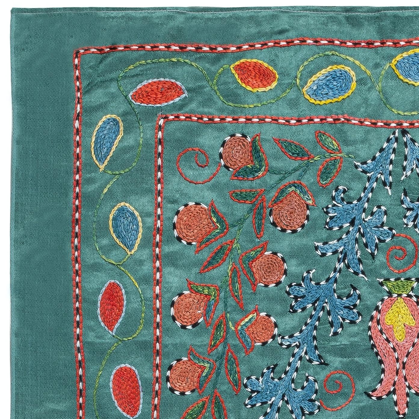 Celebrate the rich heritage of Asian craftsmanship with this exquisite 100% silk Suzani textile, meticulously hand-embroidered by skilled artisans. A true work of art, this piece embodies centuries of tradition, featuring intricate floral and