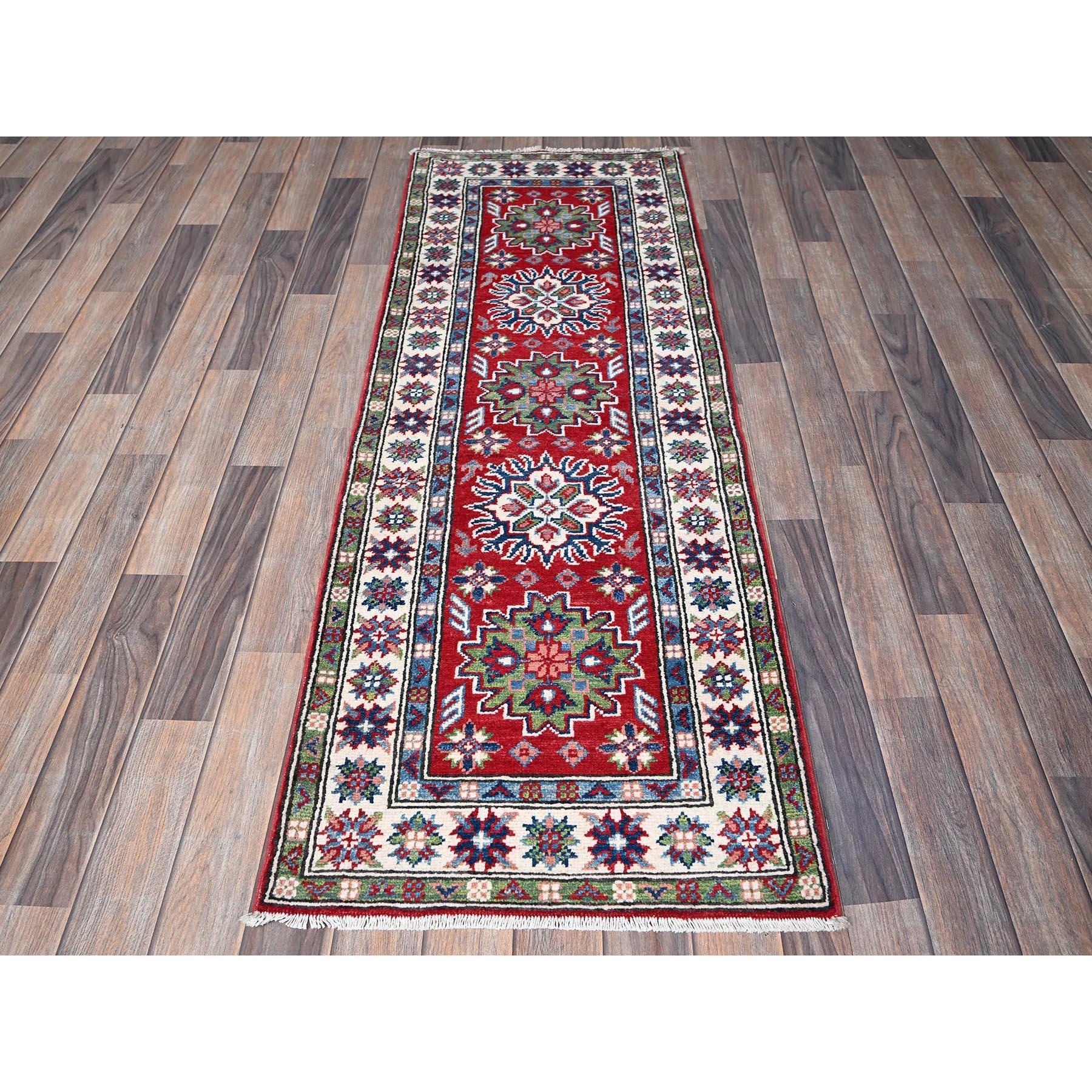 Berry Red, Kazak with Tribal Medallions Design, Hand Knotted, Soft and Shiny Wool, Denser Weave, Vegetable Dyes, Narrow Runner, Oriental Rug
Primary materials: Wool
Latex: No Pile 
height: 0.25 Inches
Style: Traditional
Primary color: Red
Secondary