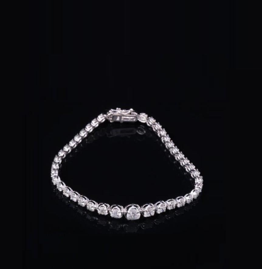 The Following Item we are offering is a Rare Important 18KT Gold Gorgeous Fancy Diamond Tennis Bracelet. Stones are Glittering and Extremely Fine!!! Set with 42 round diamonds approx. 5.50 CTS!!!
This Gorgeous Bracelet is a Rare Masterpiece that