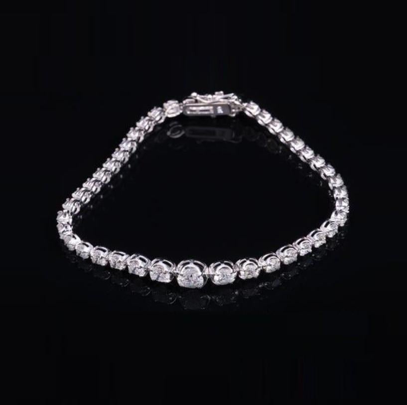 Round Cut 22, 500 18KT Important Magnificent Glittering Graduated Diamond Tennis Bracelet For Sale
