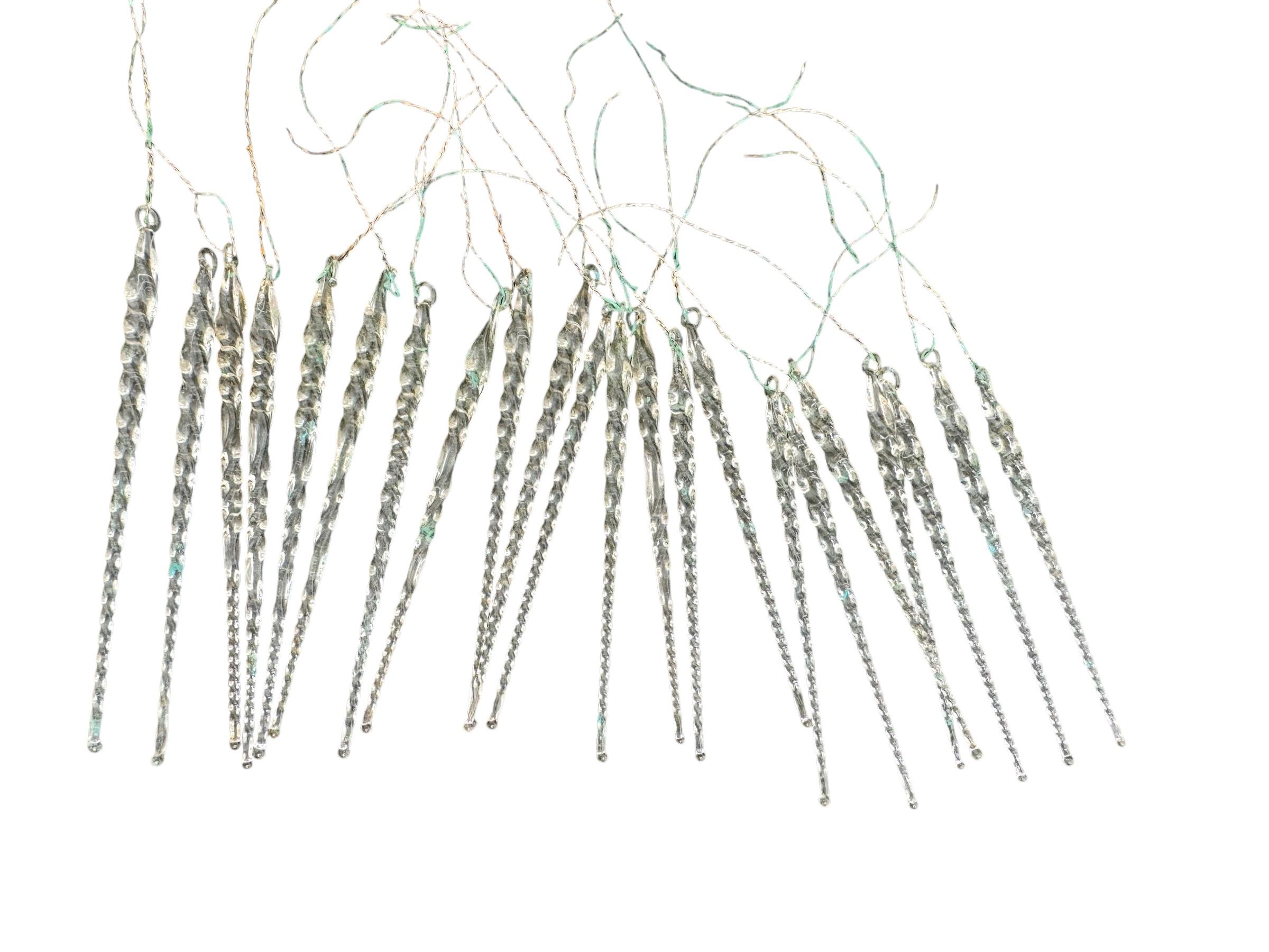 A rare lot of antique twisted icicle glass ornaments for your feather tree. The size given in the dimensions section refers to the largest item seen in the first picture. These ornaments, were made from ultra-thin hand blown glass, would be a great