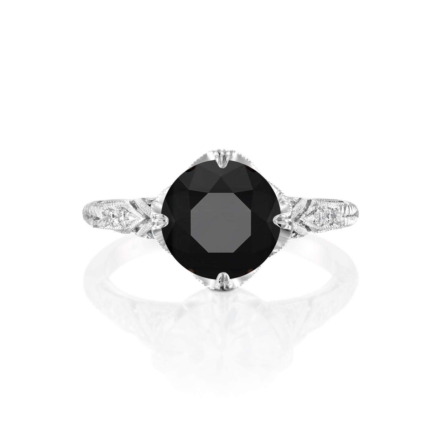 Beautiful solitaire with accents black diamond engagement ring. Center stone is natural, round shaped, black color AAA quality 2 carat diamond surrounded by smaller natural round diamonds of 0.2 total carat weight. The total carat weight of this