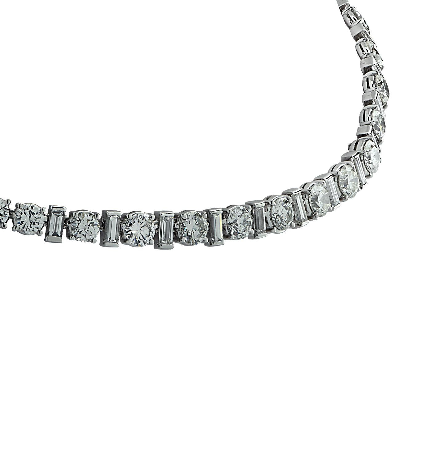 Spectacular diamond riviere necklace crafted in Platinum featuring 69 round brilliant cut diamonds weighing approximately 20.00 carats total, F-G color VS-SI clarity and 16 baguette cut diamonds weighing approximately 2.00 carats total, G color, VS