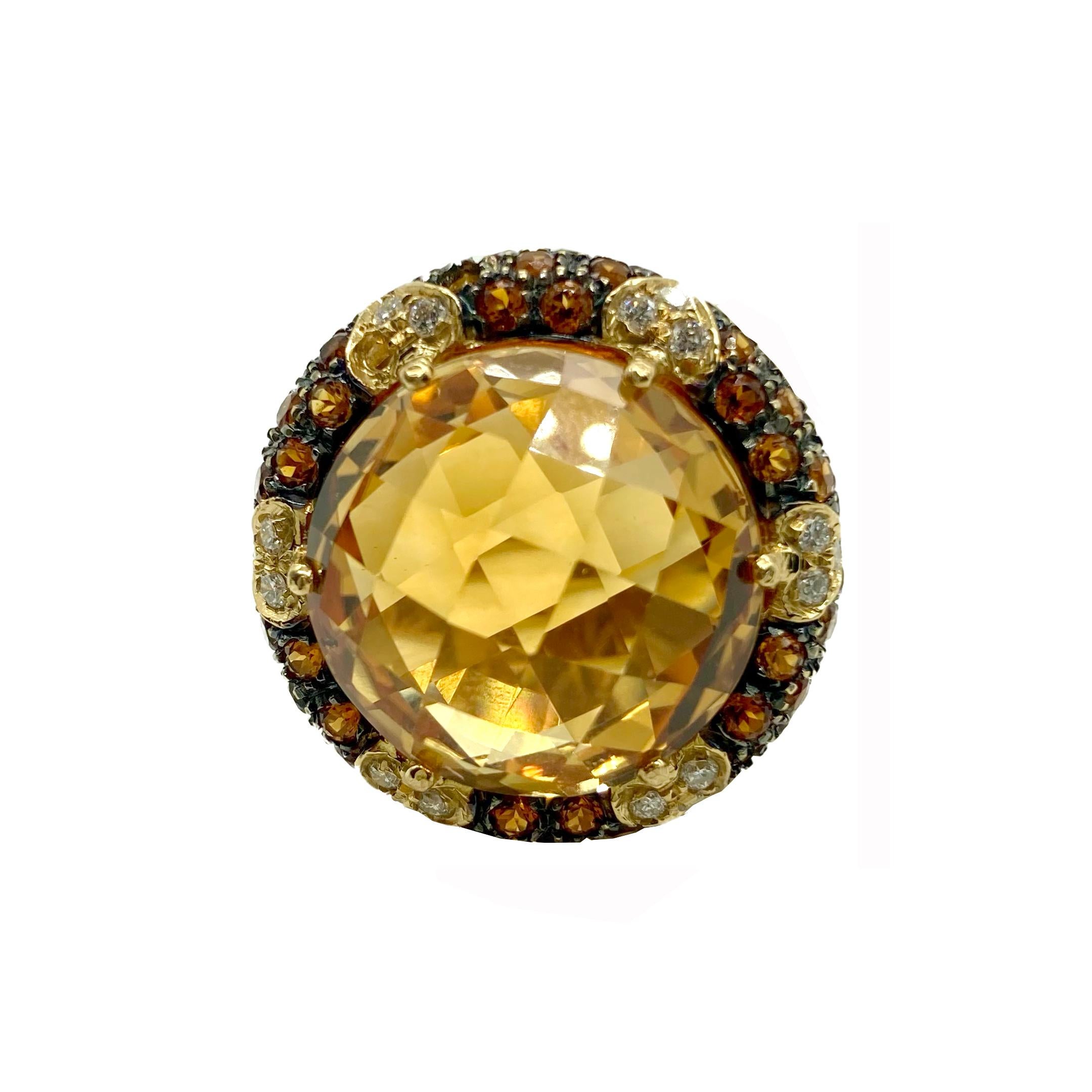 A beautiful 18 karat yellow gold cocktail ring centering a 22 carat modern rose cut citrine, accented by 56 round cut citrines totaling 1.5 carats and 18 round brilliant diamonds totaling approximately .40 carats.