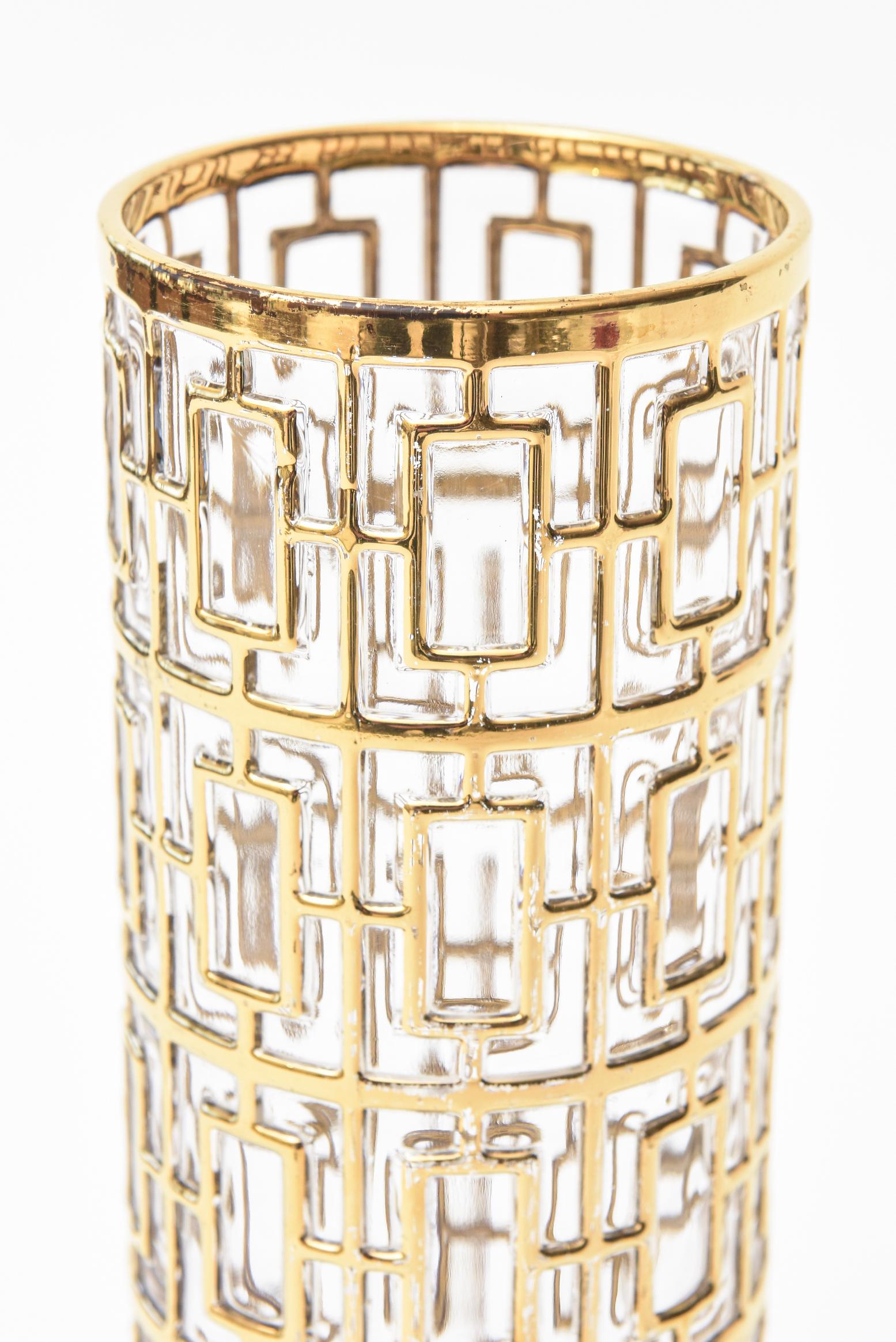 This wonderful vintage signed Imperial glass vase or cocktail mixer from the 1960s has 22-carat gold-plated Greek key like shohji screen or trellis overlay over the clear glass cylinder. It is the company of Imperial Glass from Ohio. This vase now