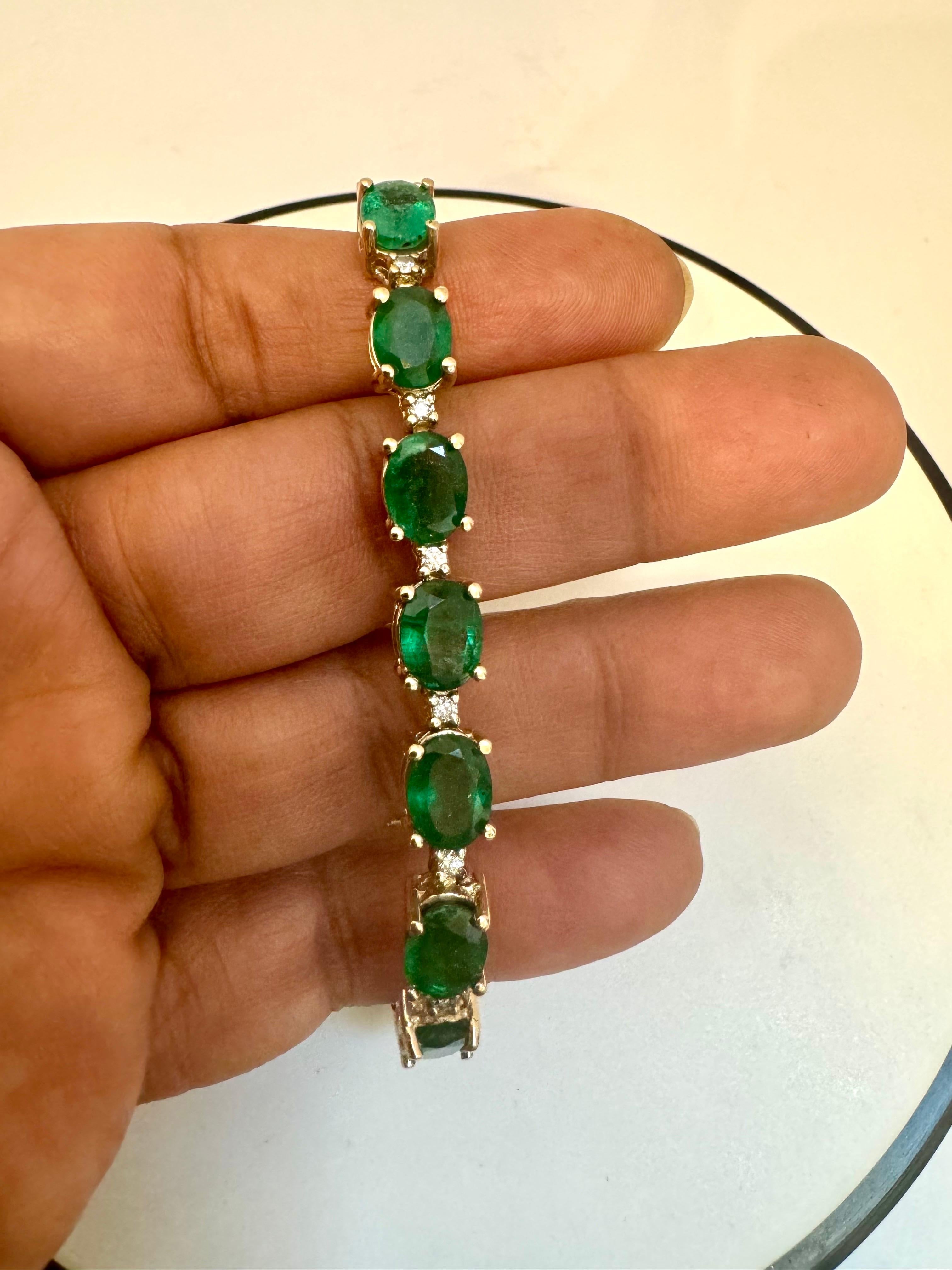 Introducing our remarkable 14 Karat Gold Tennis Bracelet adorned with approximately 22 carats of natural Brazilian Emeralds and dazzling diamonds. This high-quality bracelet features 16 oval emeralds, carefully separated by brilliant-cut diamonds.