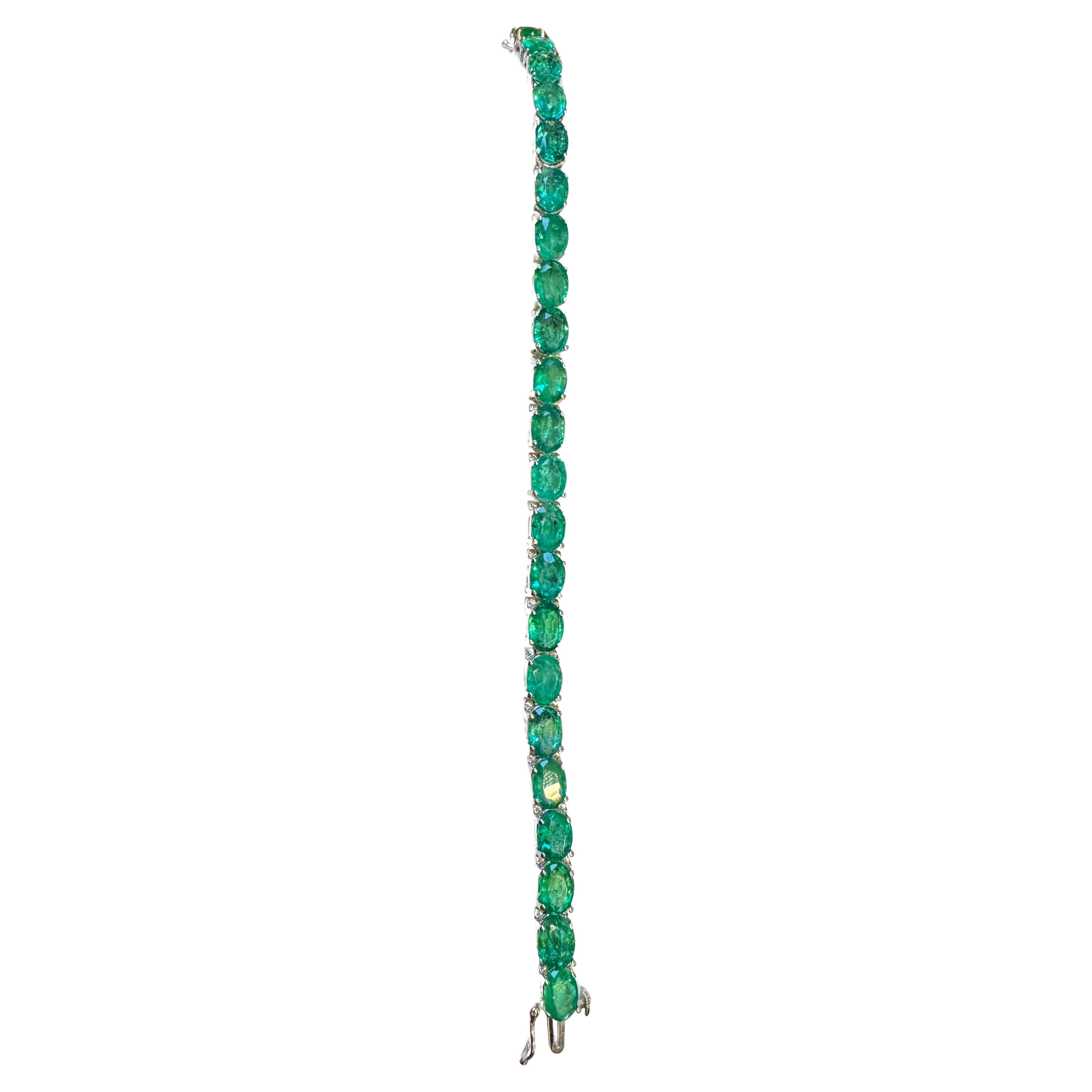  This exceptionally affordable Tennis  bracelet has  22  stones of oval  Emeralds  .  Total weight of the Emeralds is  approximately 22 carat. 
The bracelet is expertly crafted with 17 grams of  14 karat White  gold . Have a safety clasp .
Standard