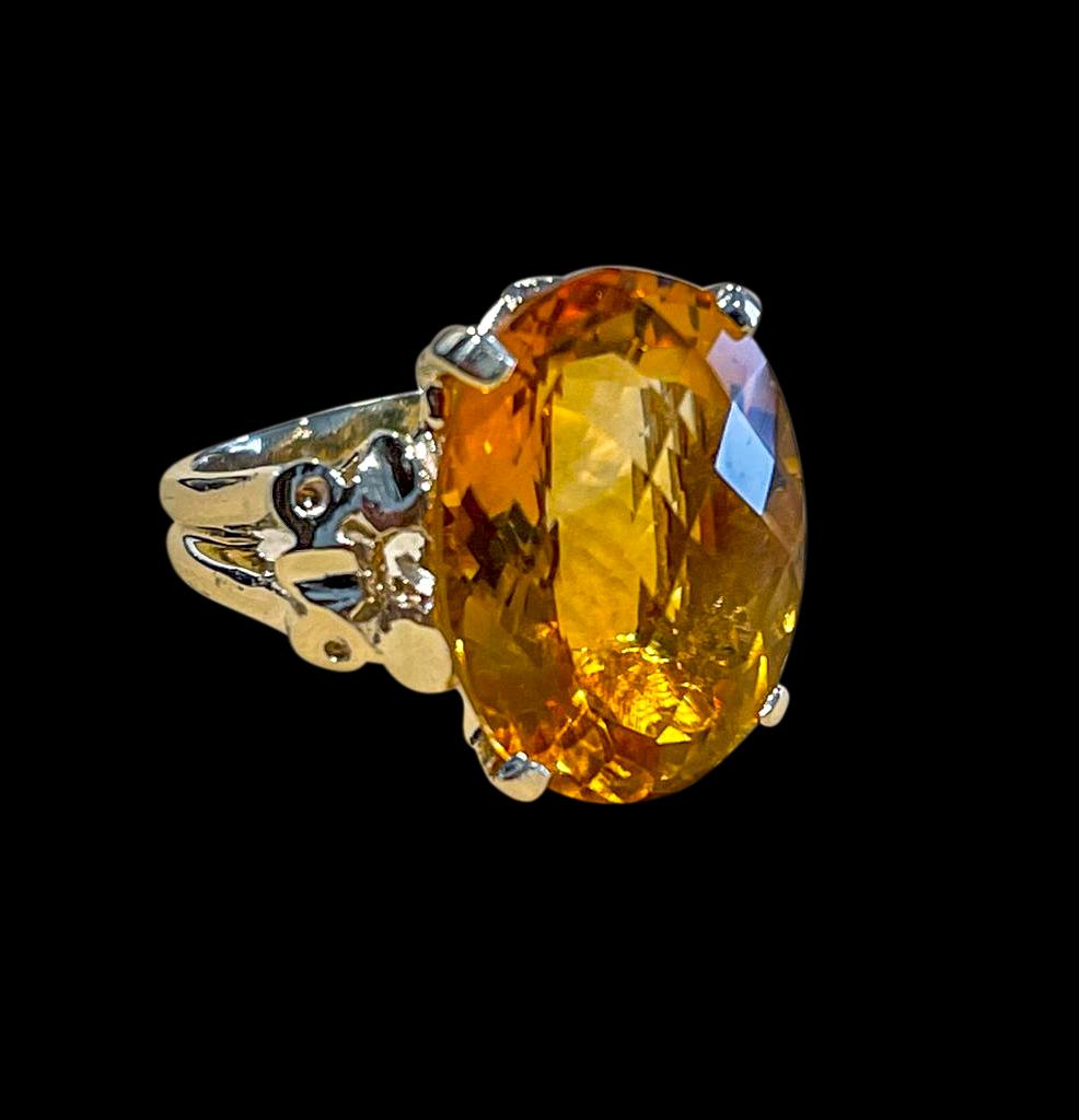 Approximately 22 Carat Natural Oval Citrine Cocktail  Ring in 14 Karat Yellow Gold, Estate 

This is a ring which has a  approximately 22 carat of high quality Citrine stone. The stone is 16 X 20 MM and 10 mm Deep
Color and clarity is very nice.
 No
