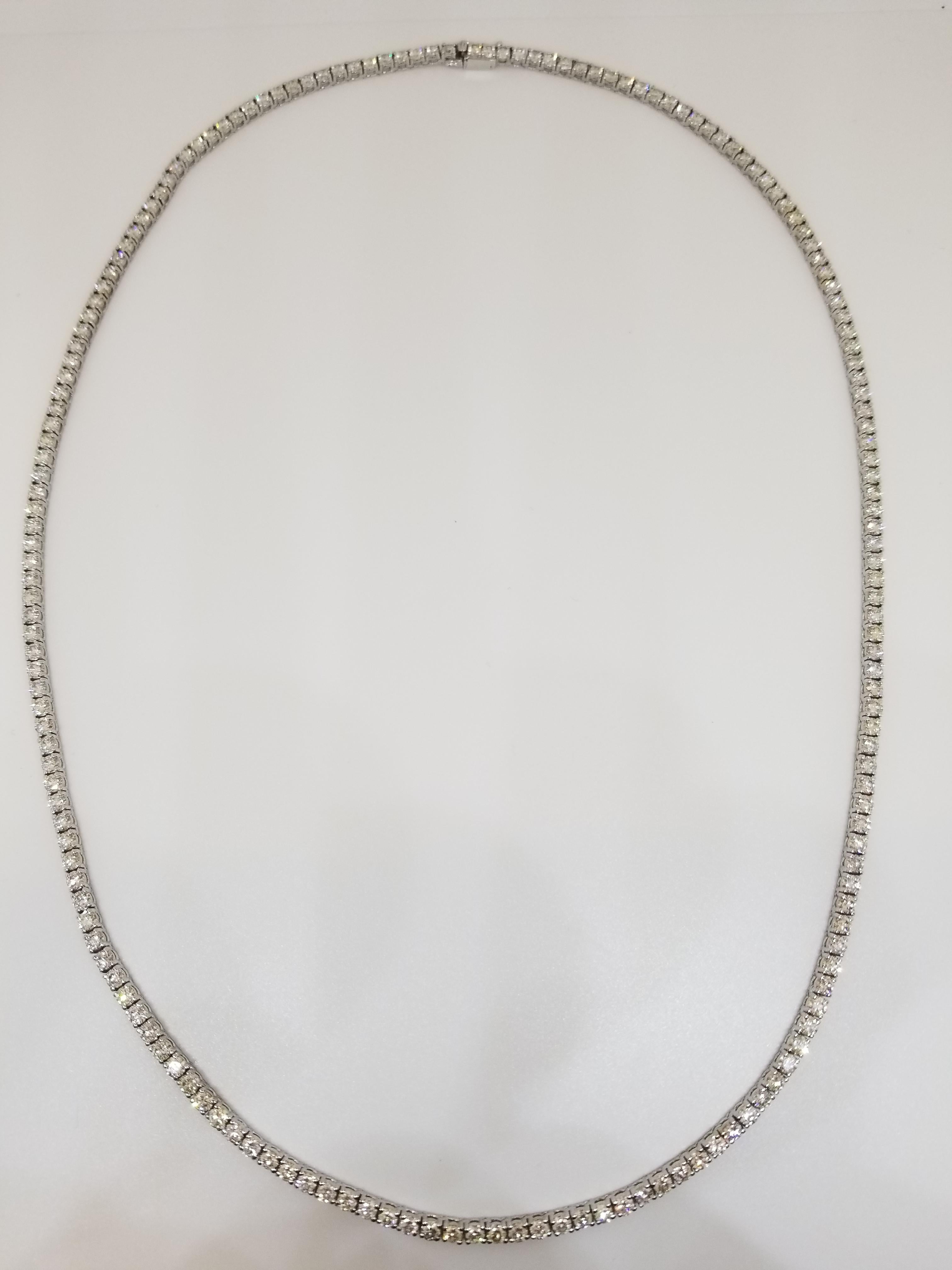 Stunning 14 Karat White Gold Round Brilliant Cut Diamond Tennis Necklace set on 4 prong setting. The total diamond weight is 22 carats. The closure is an insert clasp with safety clasp. Length is 22 inches.