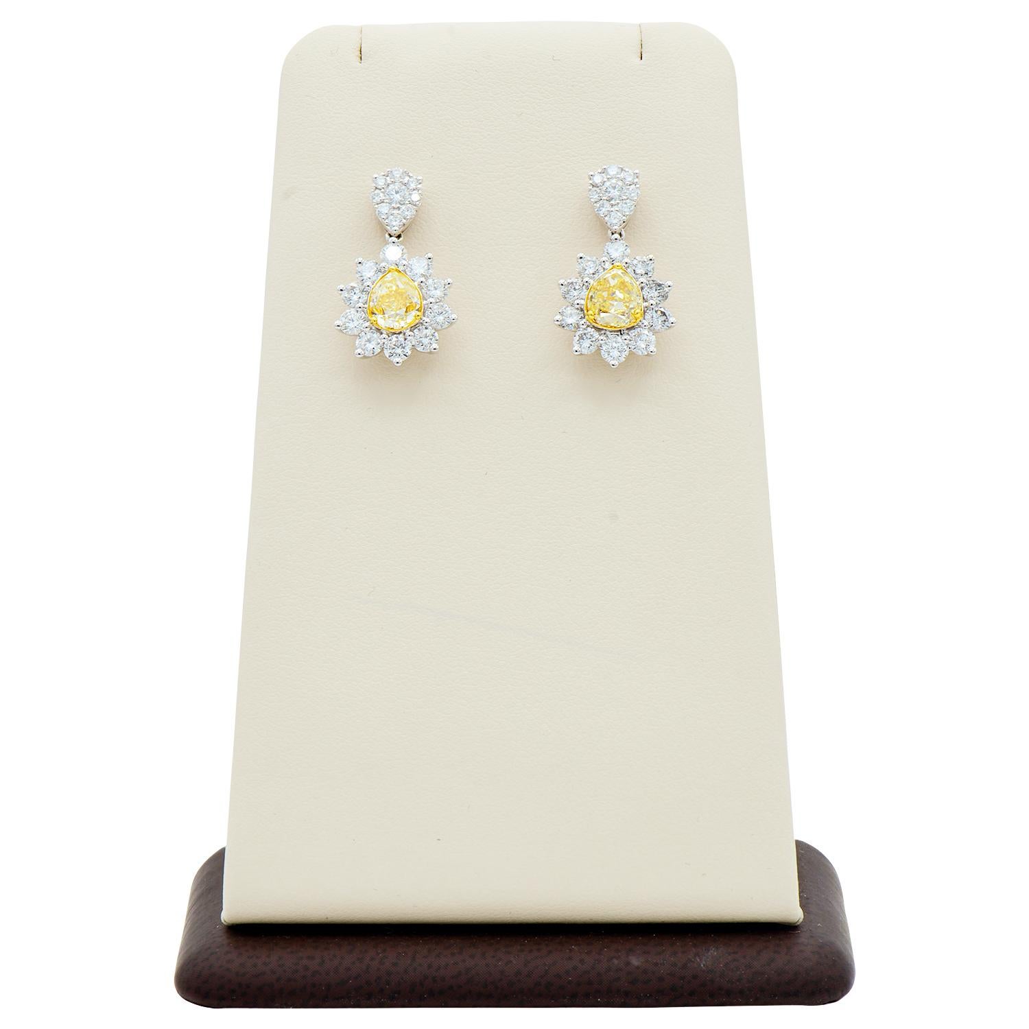 Pear Cut 2.2 Carat Yellow Diamond Drop Earrings with White Diamonds For Sale