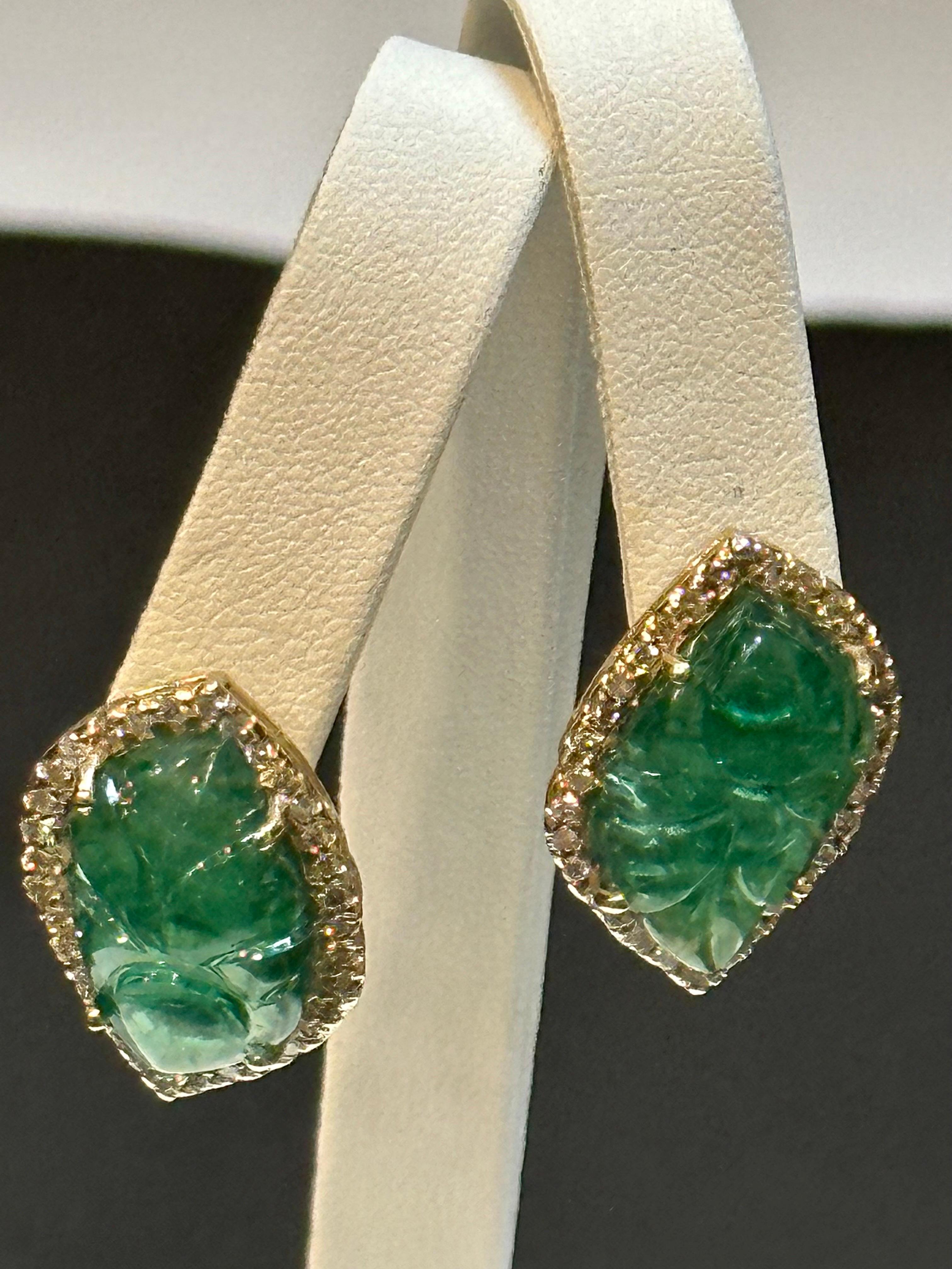 Known weight of 21.90  Ct Carved Emerald  &  2 Ct Diamond Earrings 14 Karat Yellow Gold Post Earrings

 Emerald  Diamond  Post  Earrings  14 Karat  Yellow Gold 
Two fine carved  leaf emeralds of total 21.90 ct  exact known weight
Emeralds are