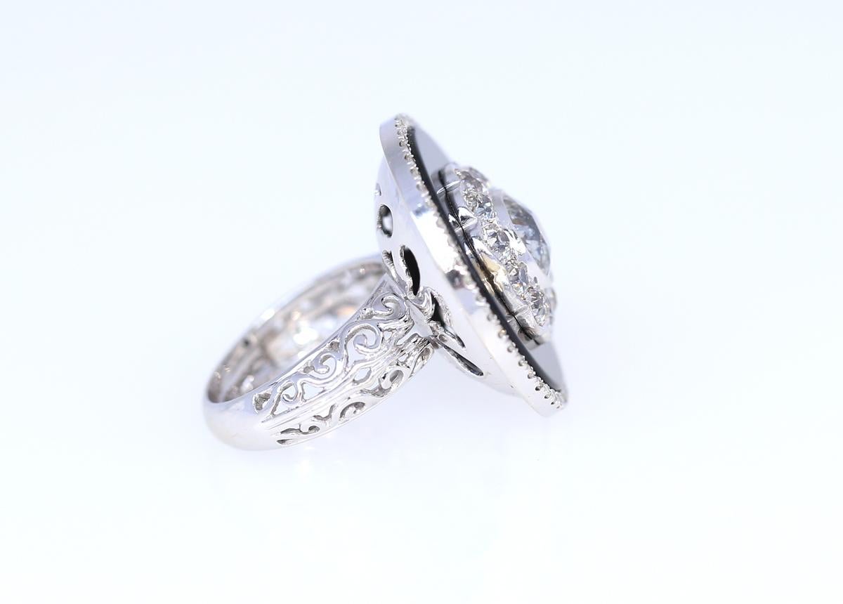 2.2 Carats center Diamond and 1.65 Ct Diamonds around, Onyx and more Diamonds on the outer line approximately 0.50 Ct. 
Total Diamonds weight is 4.35 Carat. Please take a look at the Gemological Certificate for full details. Europe 1930. White