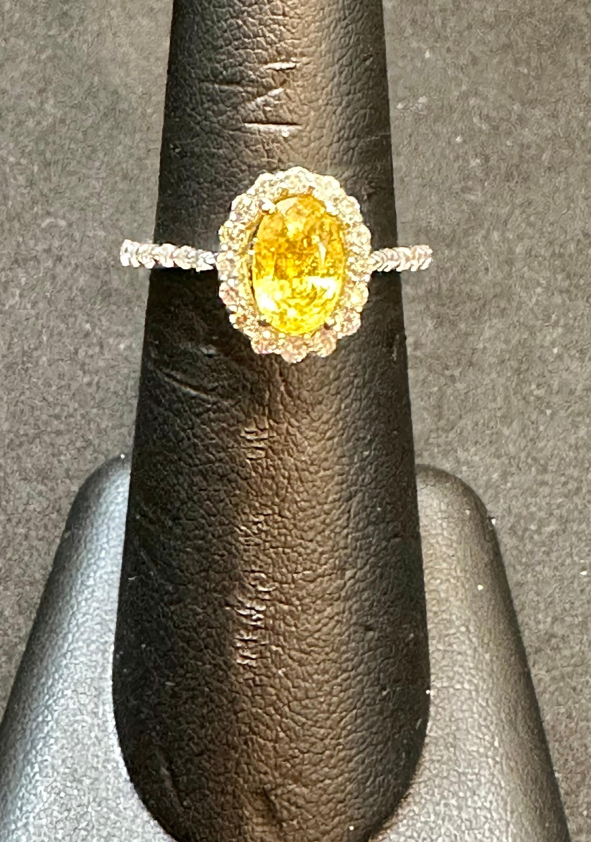2.2 Ct Oval Cut Natural Yellow Sapphire & 1 Ct Natural Diamond Halo Engagement Ring Size 7 in 14 K white Gold
Introducing a truly stunning piece, behold the 2.2 Carat Oval Natural Yellow Sapphire  & 1 Ct Diamond Ring in exquisite 14 Karat White