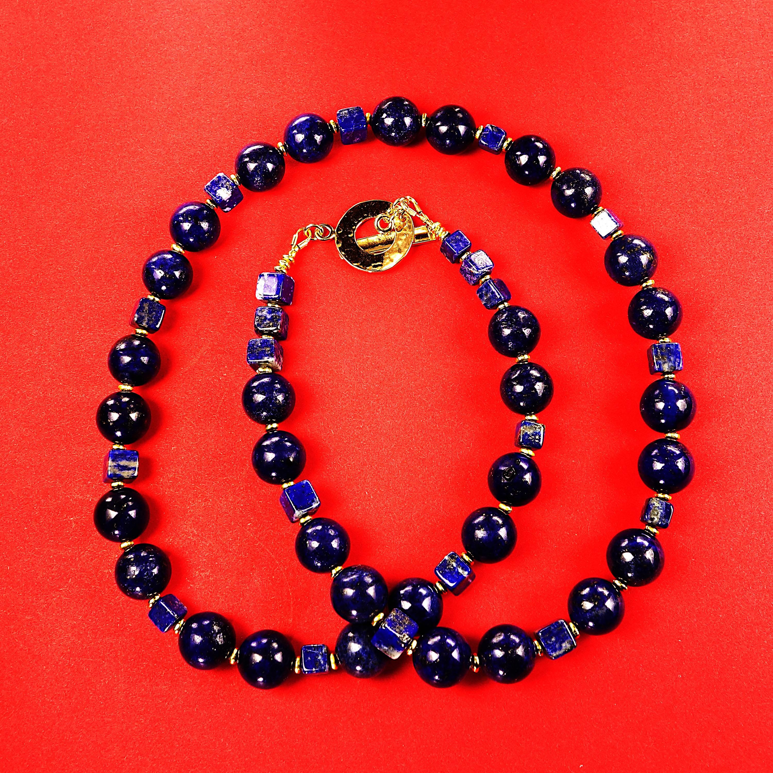 Handmade, blue Lapis Lazuli necklace in the popular 22 inch length. This, so easily wearable blue Lapis Lazuli necklace will enhance all you choose to combine with it. The clasp is a hammered gold vermeil toggle. This unique necklace features two
