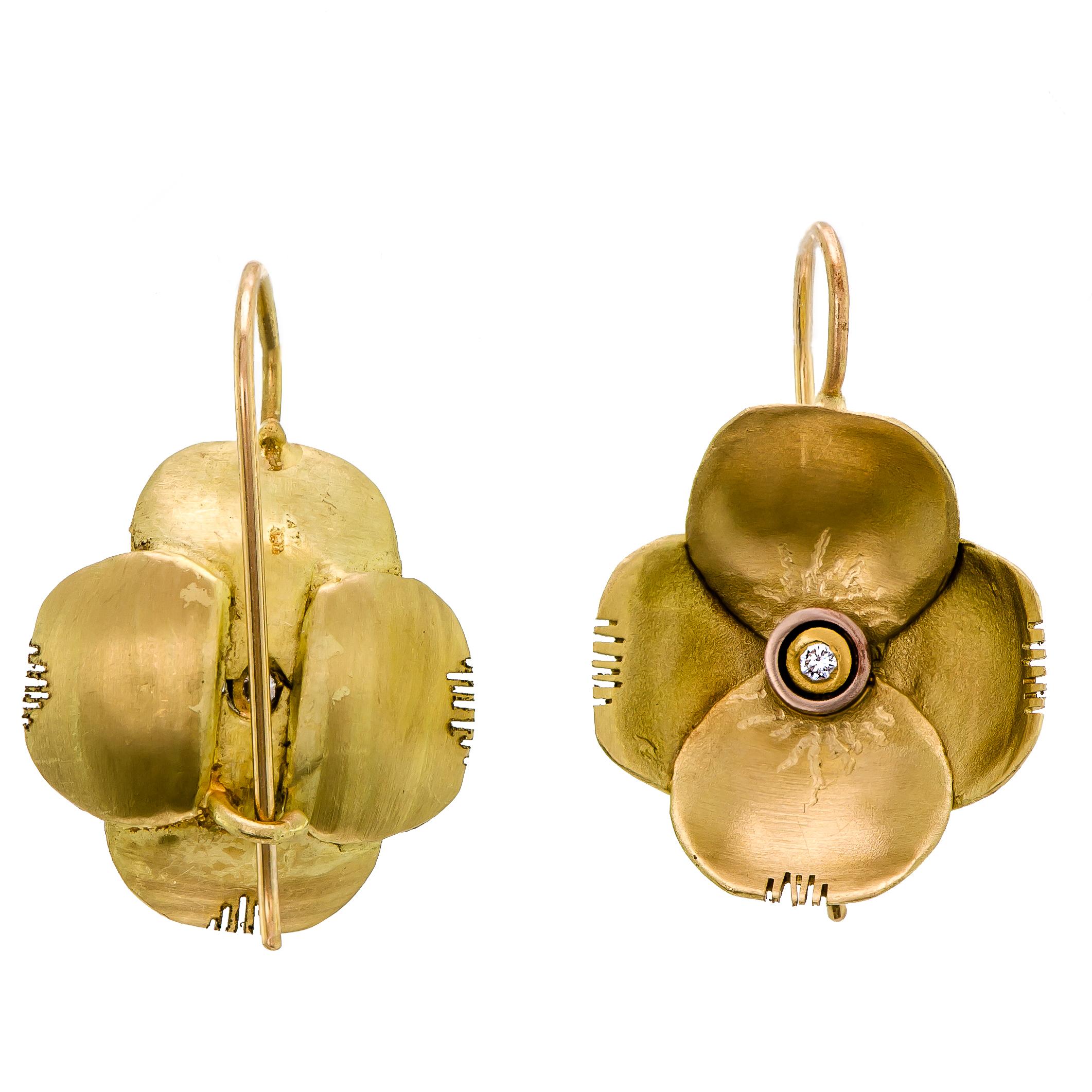 Lovely 22 Karat diamond brushed gold flower pansy form wire back earrings each bezel set with one round small full-cut diamond at the center. Very good condition. Beautiful on the ear.

Measurements: 3/4
