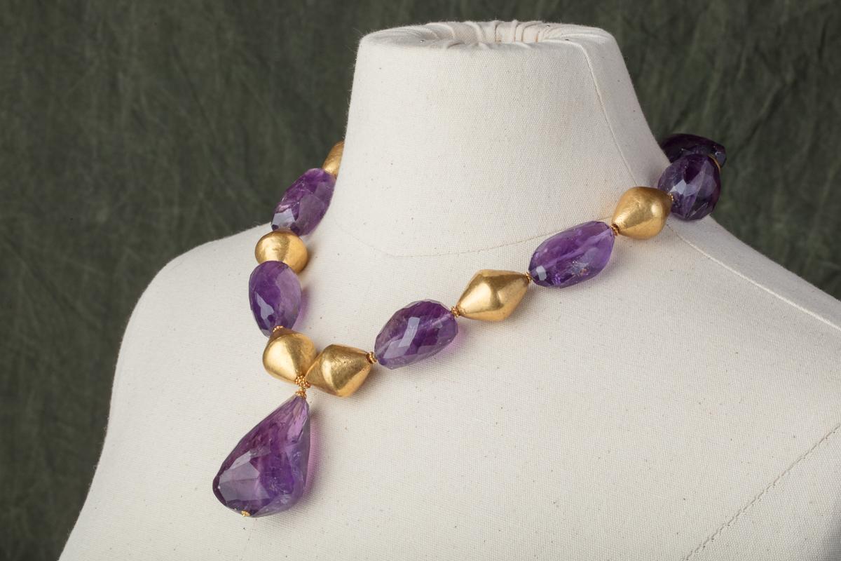 Large tumbled and faceted amethyst beads coupled with large 22K gold beads using lost wax technique, with granulated spacers.  22K gold s-hook clasp.  Drop amethyst measures 2