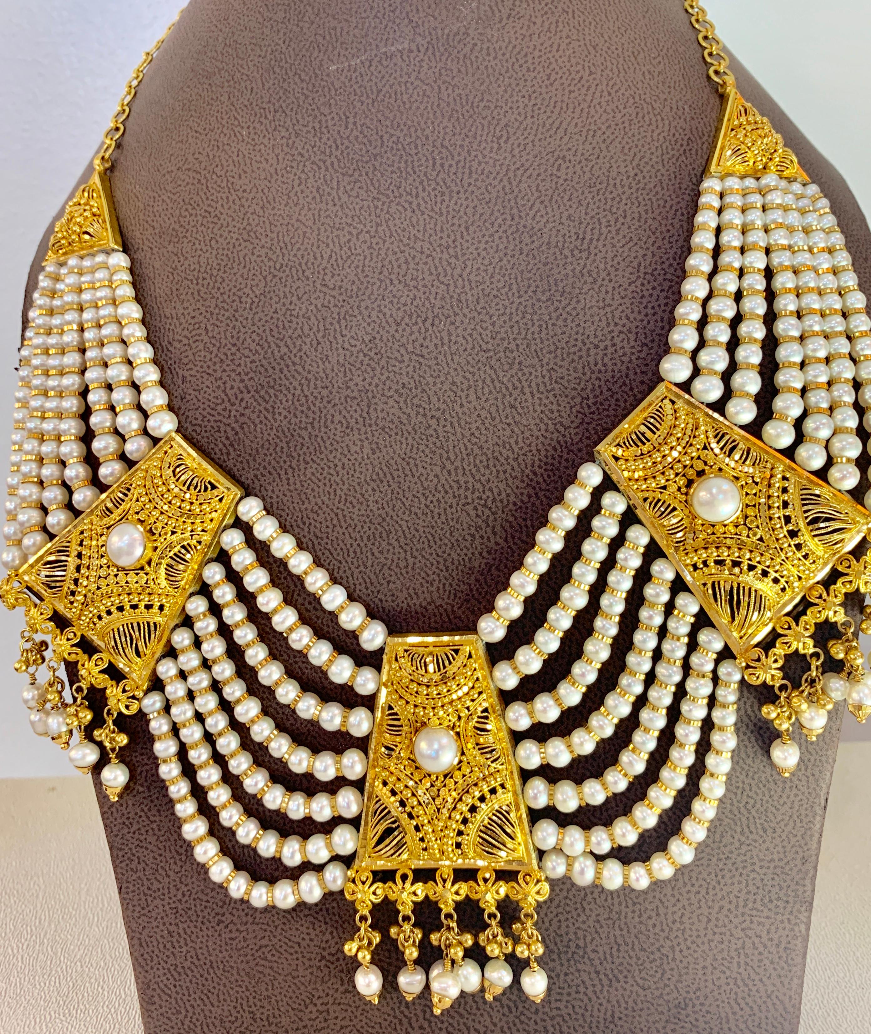  22 Karat  Gold  and Pearl Necklace  Bridal Princess Necklace
One of our very economic  Necklace  from our Bridal collection.
Three large gold pieces attached with lots of small pearl string and 22 karat gold roundels
adjustable as the chain is all