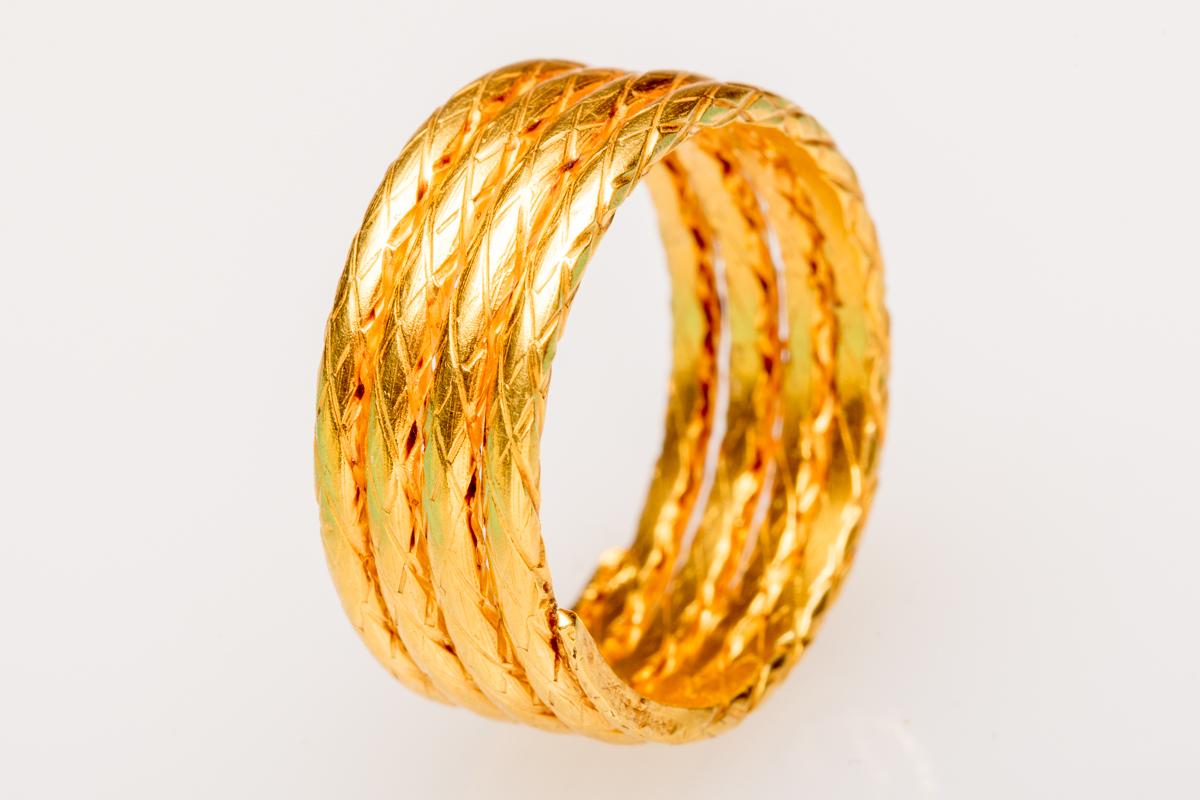 22K gold, hand - tooled coil band.  The ring has 4 coils with a hand-tooled design  in the gold.  Ring size is 8.5.