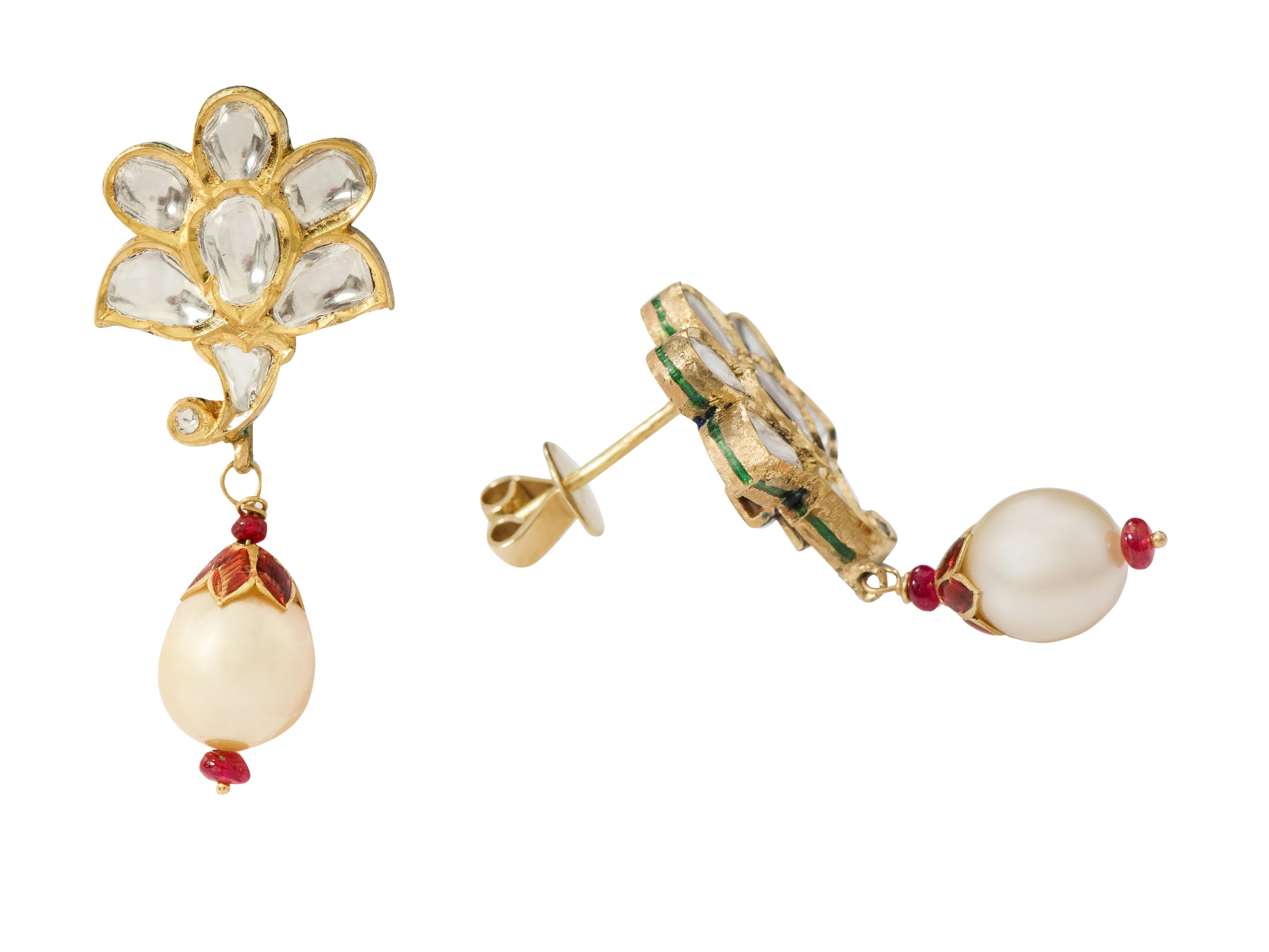 22 Karat Gold Diamond and Pearl Drop Earring Handcrafted with Multi-Color Enamel Work

This mesmerizing Mughal era hand-made polki diamond and pearl long earring is exquisite. The top part of the earring is formed of perfectly cut special shape flat