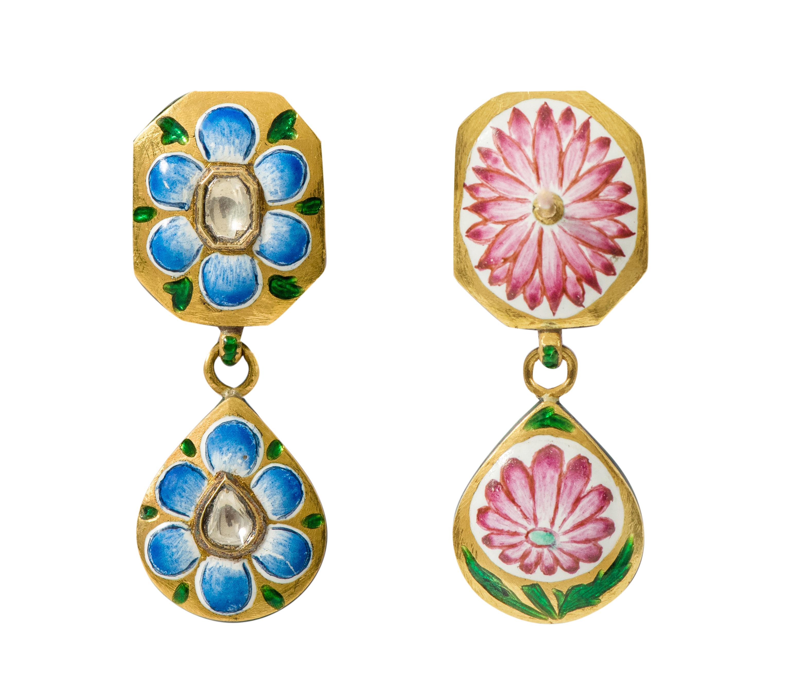 22 Karat Yellow Gold Diamond Dangle Earring with Blue and Pink Enamel Work Handcrafted

This incredulous Mughal era hand-made polki diamond and blue enamel long earring is remarkable. The bottom half of the earring is an overall pear shape formed