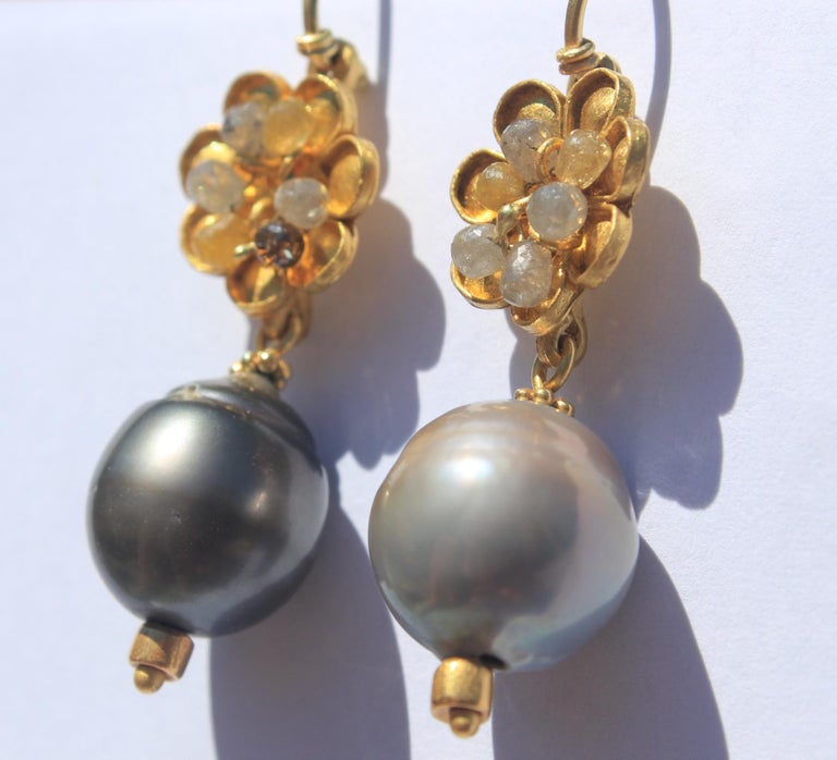 Grey Garden Drop Earrings. These 22K gold elegant contemporary dangle earrings featuring Tahitian Pearls and diamond briolettes look great worn every day. They will also dress up any outfit for a special occasion.

These earrings are made to order.