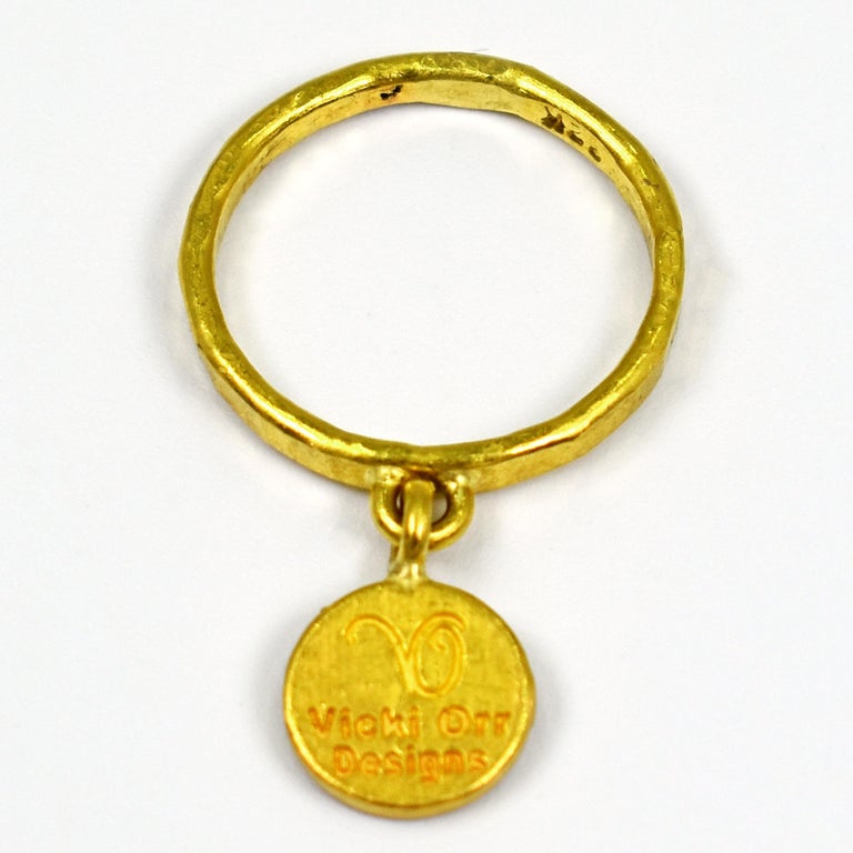 22k yellow gold ancient Greek Ixthus or Ichthus symbol charm on 22k gold hammered ring band. Ring is size 6.5. Charm is 0.56 inch in length. 