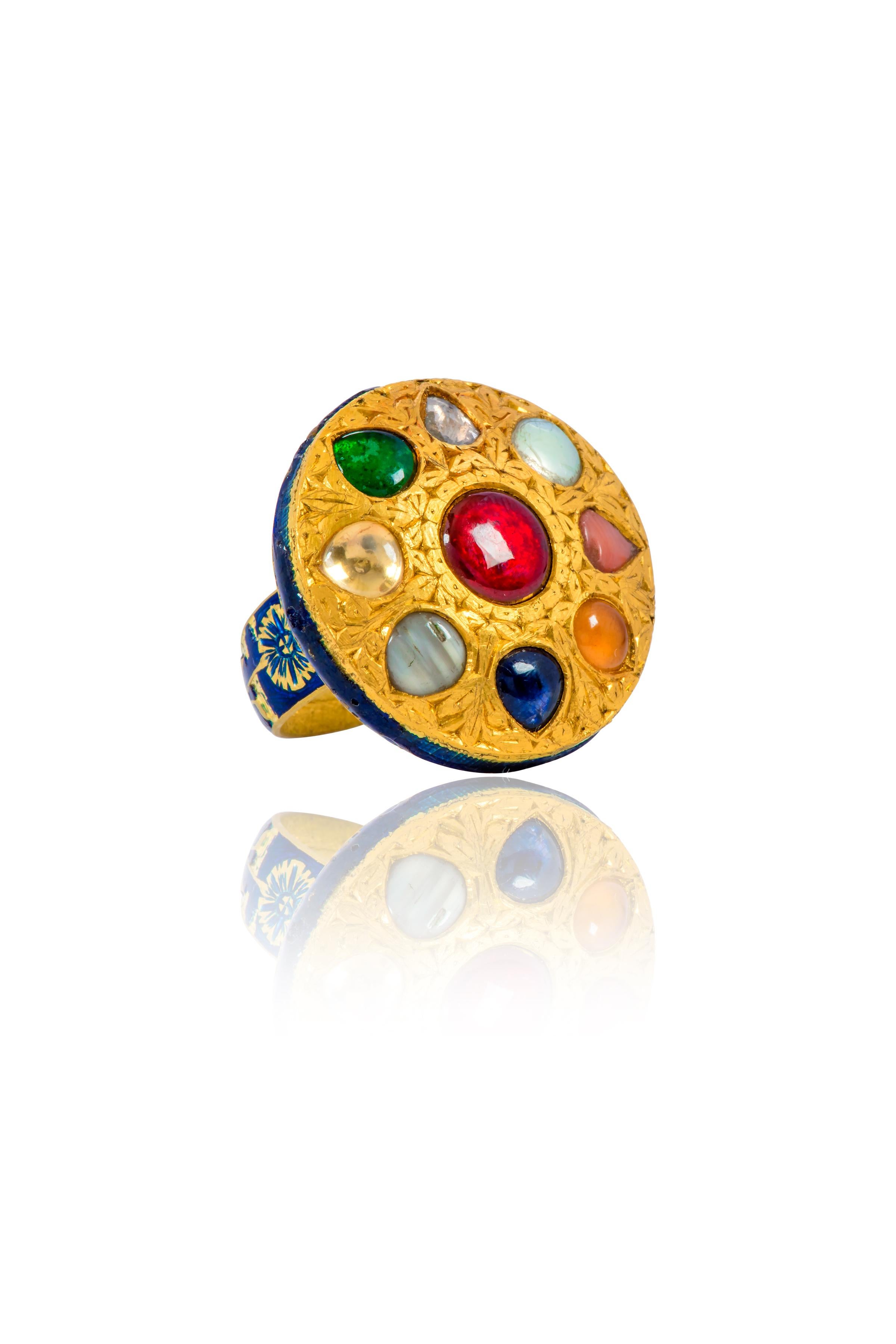 22 Karat Gold Nine Precious Gems Cocktail Ring with Blue Enamel Work

This immaculate antiquated Mughal period hand-crafted gold embroidered and blue enamel Navratan (nine) gems ring is mesmerizing. Navratnas of the nine gemstones represent the nine